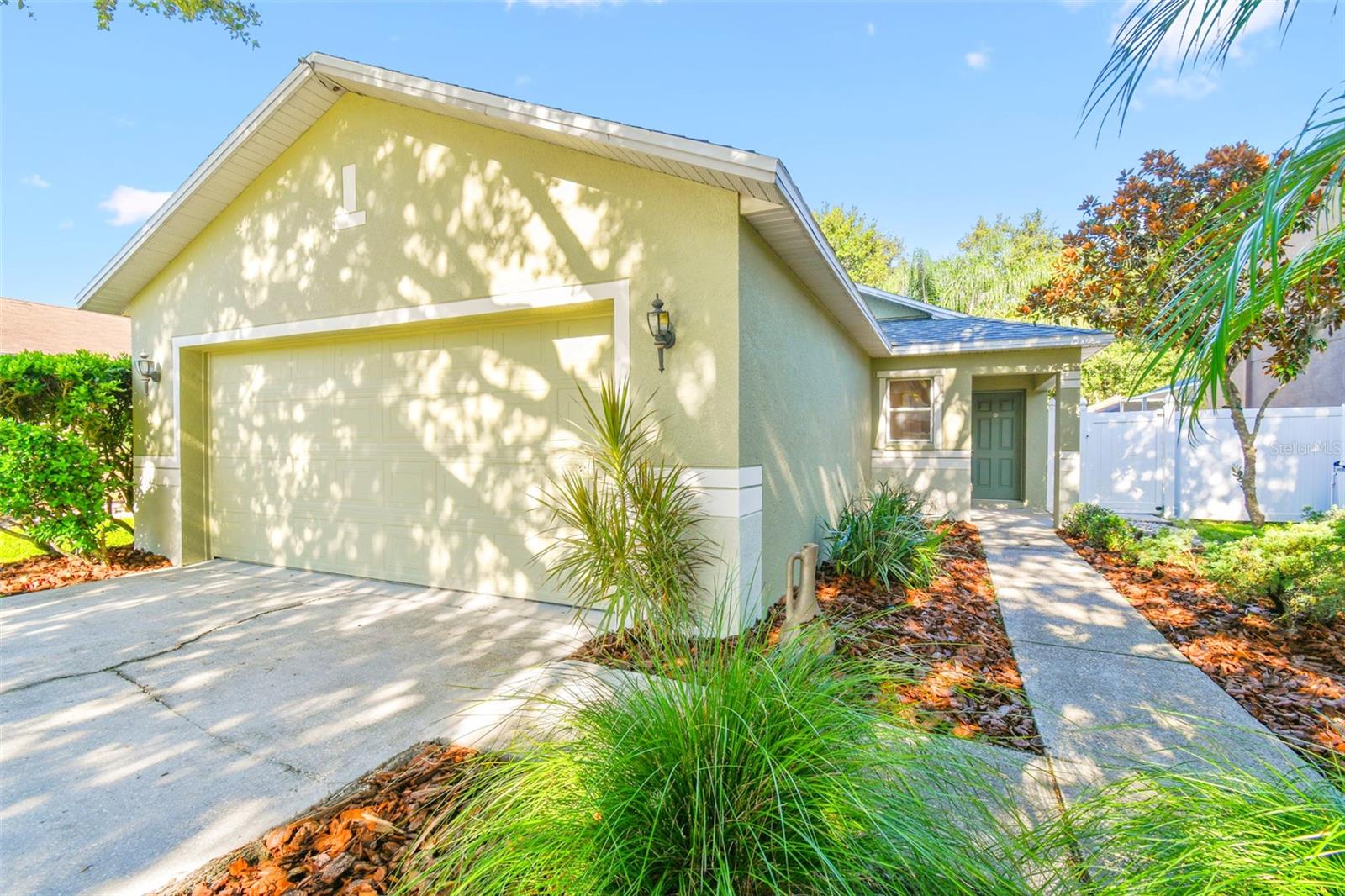 One or more photo(s) has been virtually staged. Welcome to this charming 3-bedroom, 2-bathroom home with a versatile 4th bedroom/bonus room, perfectly located just one block from the community amenity center. Enjoy NO CDD fees and a LOW HOA of only $116/month, all while having access to a beautiful pool, tennis courts, basketball court, and playground.
Step inside to find an open and functional layout featuring wood-look tile throughout for easy maintenance. The spacious master suite offers a walk-in closet, en-suite bathroom, and views of the backyard. At the heart of the home, the kitchen boasts stainless steel appliances, natural wood cabinetry, a breakfast bar, and eat-in space, flowing seamlessly into the living room and out to the patio. This home is designed for flexibility, with a partially converted garage creating a large 4th bedroom/bonus room, complete with central A/C and built-in closets. An inside laundry closet, and full built in closets add extra convenience. Enjoy peace of mind with brand new exterior paint, a NEW roof and NEW A/C (2020). Situated in a rapidly growing area, you’ll be just minutes from new shopping, dining, hospitals, entertainment, I-75, and Downtown Tampa. This move-in ready home is a rare find—don’t miss your chance to make it yours!