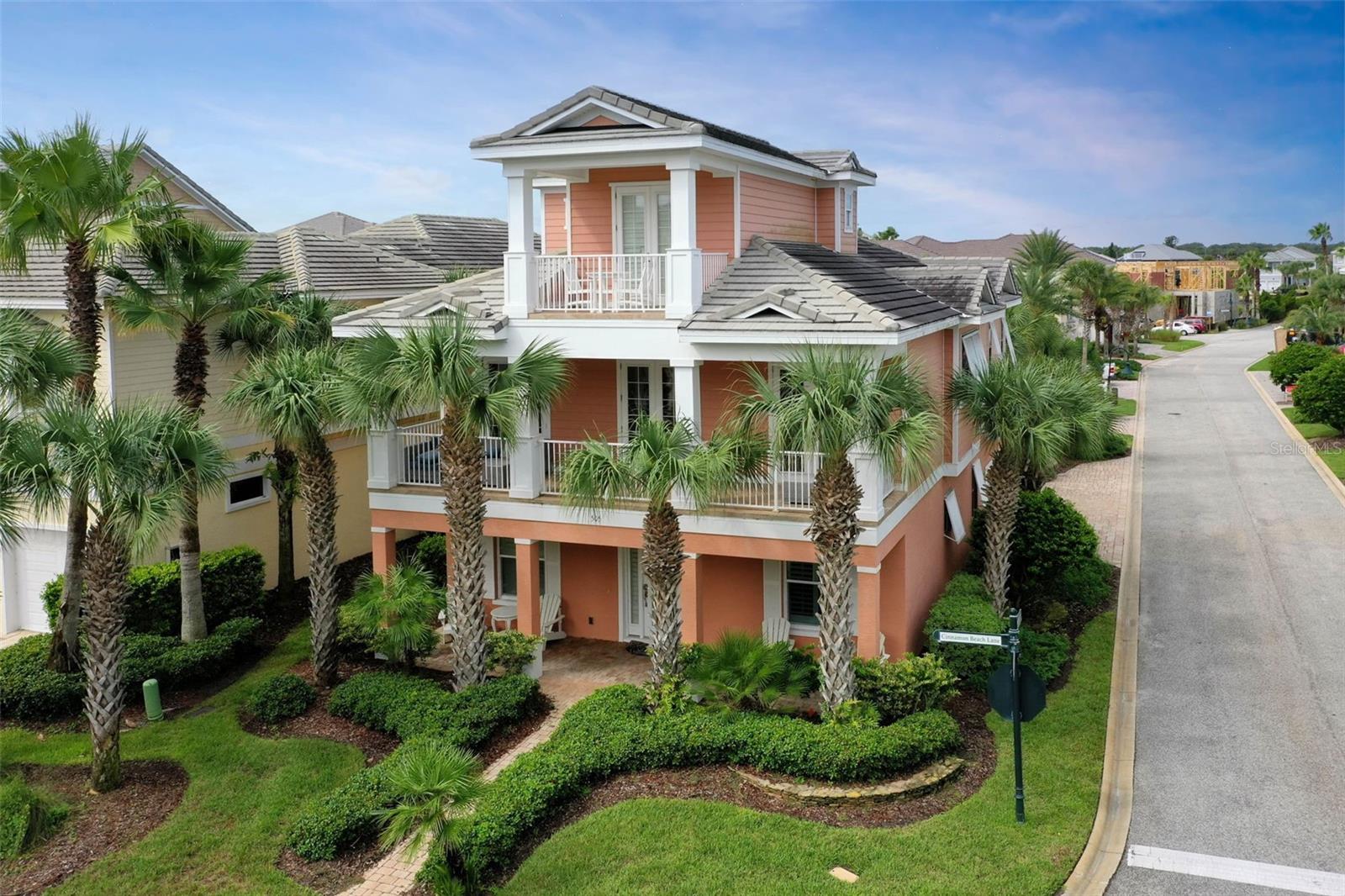 Experience the ultimate Florida coastal lifestyle in this three-story beachside retreat located directly across from the Atlantic Ocean. With ocean breezes, easy beach access just steps away, and a proven vacation rental history, this 4-bedroom, 3 full bath, 2 half bath home offers the perfect balance of private escape and investment potential.
The first floor features two guest bedrooms joined by a Jack-and-Jill bath, a guest den, and a dedicated home office that easily converts to a fourth bedroom. An oversized covered patio and outdoor shower make beach days effortless. An elevator provides easy access to all three levels.
The heart of the home is an open-concept island kitchen with granite countertops flanked by two elegant chandeliers, custom cabinetry, and a large dining area perfect for entertaining. The living room is accented by wood-inset ceilings, coastal-themed décor, and warm wood-look tile floors, creating a refined yet relaxed atmosphere. Three sets of French doors open to a wide balcony that welcomes in the salty breeze. The primary suite is privately tucked away, featuring a tray ceiling with wood detail, a spacious walk-in closet, and a spa-style bathroom with dual vanities and an oversized glass-enclosed shower. For convenience, the laundry room is located on this level as well.
Designed for both privacy and entertaining, the enclosed courtyard pool and hot tub are complemented by a large outdoor lounge with oversized sofas, a grilling station, and a fireplace. Whether hosting friends for dinner, watching the game on the outdoor TV, or enjoying a quiet night by the fire, this resort-style space is truly the centerpiece of the home.
Third Level – Private Guest Suite & Balcony. The top floor offers a guest suite with a private full bath, wet bar, and direct access to its own private balcony—perfect for taking in coastal views and enjoying a morning coffee or evening cocktail.
This exclusive gated community provides 24-hour security and a suite of amenities, including a fitness center, two pools (one oceanfront, one lakefront), a café, teen’s club room, and an adult club room.
With 3,231 square feet of beautifully designed living space, 4 bedrooms, 3 full baths, 2 half baths, an elevator, and a rare mix of privacy and resort-style features, this property offers the very best of beachside living—just steps from the sand.
