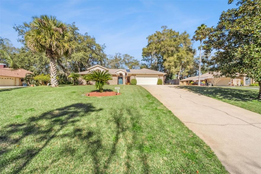 Welcome to this beautifully maintained 4-bedroom, 3.5-bath pool home nestled on over half an acre in the highly desirable Long Leaf Plantation community. Offering 2,690 sq ft of comfortable living space, this residence blends timeless charm with thoughtful updates, creating the perfect retreat for everyday living and entertaining.
Step inside to a bright, inviting layout featuring formal living and dining rooms, Spanish tile flooring, and volume ceilings that enhance the home’s spacious feel. The updated kitchen is equipped with a center island, breakfast bar, pantry, and newer appliances—ideal for the home chef. The adjoining family room opens seamlessly to the lanai through wide 3-panel sliders, filling the space with natural light and views of the pool.
The primary suite offers privacy and comfort with a walk-in closet, dual-sink vanity, and a dedicated tankless water heater. Three additional bedrooms provide flexibility for family, guests, or a home office.
Step outside to your own Florida oasis. The screened, heated saltwater pool and spa—complete with remote controls—create the perfect setting for relaxation. The expansive covered lanai, beautifully landscaped yard, and fully fenced property offer both tranquility and space to entertain. A side-entry 2-car garage, long driveway, and additional parking pad provide ample room for vehicles and storage.
Located in a peaceful, established neighborhood just minutes from shopping, dining, and historic Downtown DeLand, this home delivers the ideal blend of privacy, comfort, and convenience.