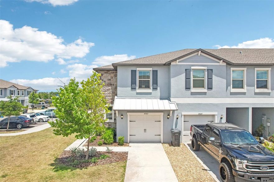 Welcome home to this beautiful, low-maintenance 3-bedroom, 2.5-bathroom end-unit townhome with a 1-car garage in the highly desirable, master-planned community of Belmont. As a coveted end unit, this home enjoys extra privacy and wonderful natural light throughout. The main floor features durable ceramic tile, a convenient half bath, and a spacious, open-concept living and dining area that flows seamlessly into the kitchen. The kitchen is a chef's delight, complete with a breakfast bar, sleek stainless steel appliances, and rich dark wood cabinets. Upstairs, you will find a versatile loft area perfect for a home office or second living space, alongside a dedicated second-floor laundry room for ultimate convenience. The primary suite serves as a private retreat, boasting a large walk-in closet and an en-suite bathroom with double sinks and a spacious walk-in shower. Two additional nicely sized bedrooms share a well-appointed full bathroom. Out back, the covered lanai offers the perfect spot to relax and unwind. Ideally located just minutes from I-75, shopping, and dining, residents also get to enjoy all of Belmont's premier amenities, including resort-style pools, parks, walking trails, and recreational facilities.