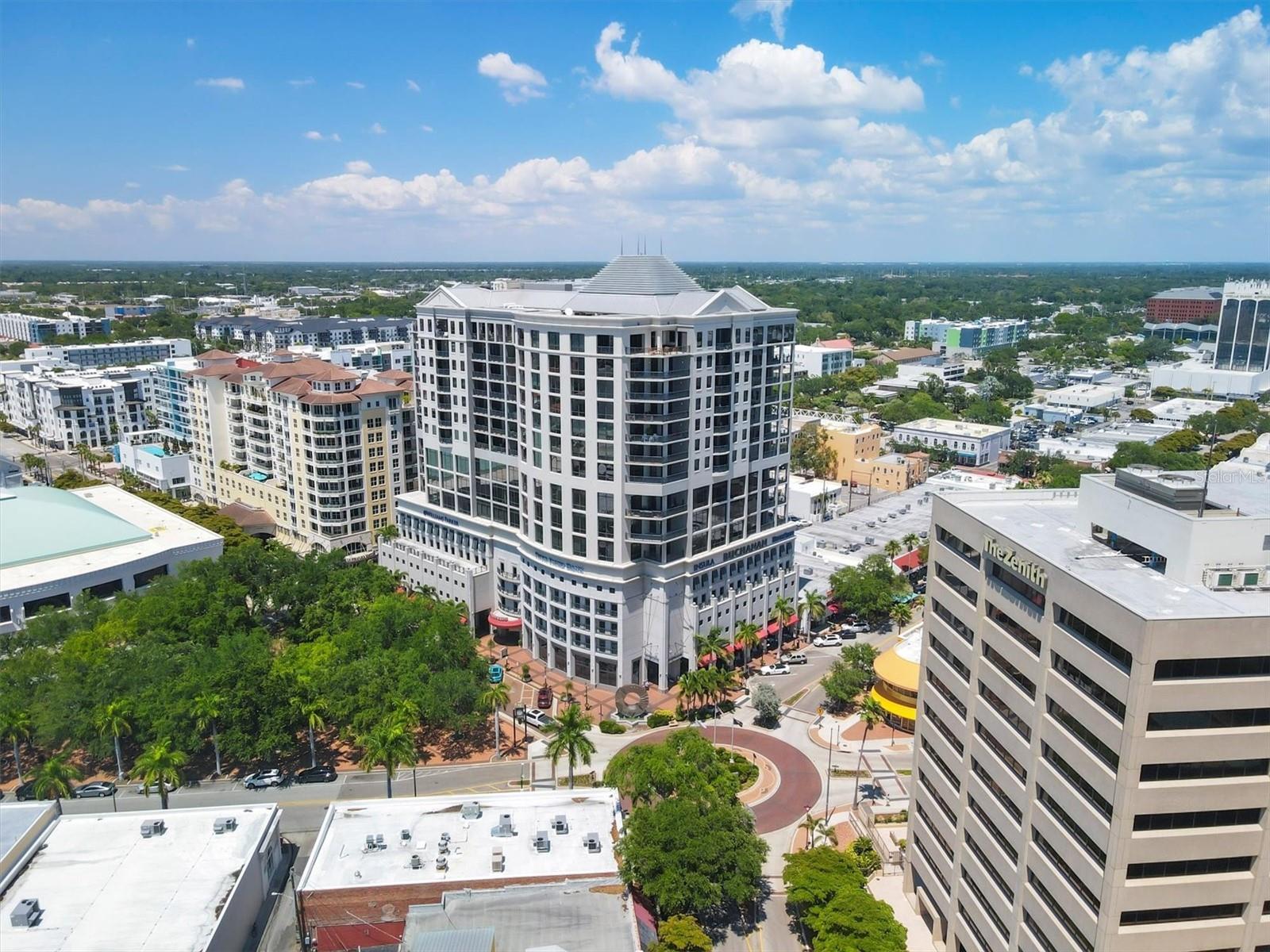 Elevate your lifestyle in this highly sought-after 15th-floor corner residence at The Plaza at Five Points, ideally situated in the vibrant heart of downtown Sarasota. This beautifully designed two-bedroom, two-bathroom split floor plan offers privacy and functionality, with expansive windows in every room that invite abundant natural light and showcase stunning city views. Select living areas are enhanced by floor-to-ceiling glass, adding to the home's airy and polished appeal.
The interior features timeless tile flooring throughout and a sleek, modern kitchen equipped with an induction cooktop and abundant cabinetry for exceptional storage—perfect for the discerning home chef. The spacious primary suite delivers comfort and tranquility with ample closet space, while the versatile guest suite easily doubles as a home office or private retreat.
Rarely found in downtown living, this residence includes two deeded parking spaces and a private storage room, with valet parking available for guests. Step outside and immerse yourself in Sarasota’s finest: world-class dining, upscale shopping, arts, theaters, and the sparkling waterfront—all just moments from your doorstep.