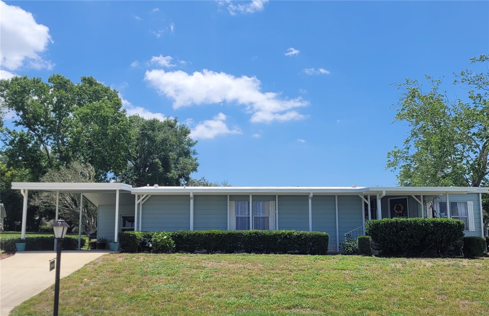 Zellwood Station 2-bedroom 2 bath home. LAND OWNED CORNER LOT with $242.00 MONTHLY HOA. MOVE IN READY! This home is walking distance to the Citrus Ridge pool and mail room. Very nice open floorplan has large living dining room area. There is a Florida Room off the dining room with room for an office, craft room, extra living or even convert to a bedroom. Both bedrooms are roomy with plenty of closet space and there is a storage room off the kitchen as well. Membrane roof-over in 2011. Zellwood Station is a Resident Owned 55+ Golfing Community located between Apopka and Mt Dora. We have a 72 Par golf course, 4 pools, pickleball and tennis courts and our own Whistle Stop Restaurant and Lounge with banquet facilities. There is always something to do here. Close to the 429 for easy access to airports and attractions, we are close to shopping, restaurants, medical facilities and churches. Come and see what we have to offer!
