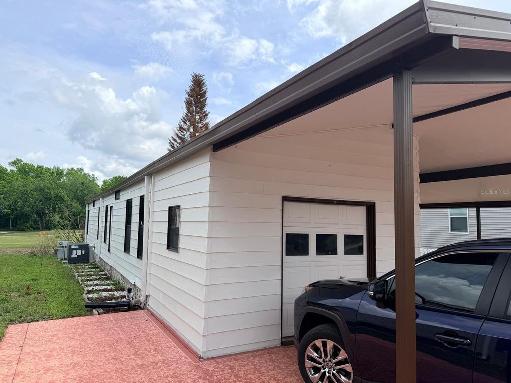 Photo of 2173 Pebble Beach Boulevard, Orlando, FL 32826 (MLS # O6396809)