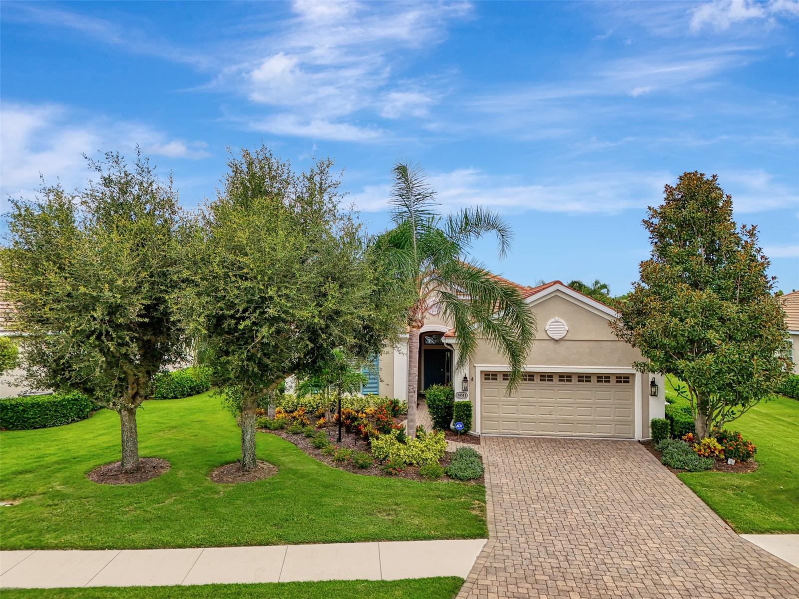 Discover lakeside living at its finest in this beautiful 3-bedroom, 2.5-bath home located in the highly sought-after Country Club East community. Boasting 2,487 square feet of thoughtfully designed space, this property offers a light, bright great room floorplan with a magnificent lake view.
Step out to the huge lanai—an ideal spot to unwind and take in the serene, gorgeous views of the water. Inside, the generous walk-in closet in the primary suite ensures plenty of storage. Need a quiet place to work or study? This home also features a large dedicated office space to suit your needs.
Enjoy peace of mind with recent updates, including a new washer, dryer, water heater, and upgraded front landscaping. Most lighting throughout the home has also been updated, providing a fresh, modern feel.
Live maintenance-free in this gated, resort-style community where the HOA takes care of your landscaping, leaving you more time to enjoy the amenities. Residents have access to three amenity pools, meeting rooms, and a fitness center. Additional membership options available for golf, tennis, pickleball, a larger fitness center, and exquisite dining with Lakewood Ranch Country Club.
Experience comfort, convenience, and the best of lakeside living in this exceptional home—schedule your private tour today!