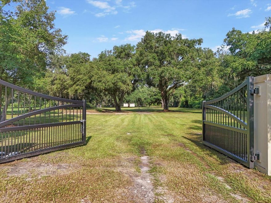 Discover the ideal setting for your dream home on this 2.32-acre lot, beautifully adorned with majestic oak trees! With a power, well and septic system already in place, you're ready to start building your custom home right away. Enter through a custom steel gate into a fully fenced paradise that welcomes horses and offers boundless space for your vision. Enjoy the freedom of no HOA restrictions or fees.  Enjoy the convenience of being close to I-4, shopping, and schools. Imagine your new home surrounded by impressive estates on spacious lots, with the lot mostly cleared and ready for your unique touch. Just minutes from Fair Grounds for concerts, and only a quick 20-minute drive to Downtown Tampa, you'll have all the excitement of Channelside, Tampa Riverwalk, Amalie Arena, and countless restaurants and attractions at your fingertips. Experience the best of both worlds—serene country living with all the perks of city life!
