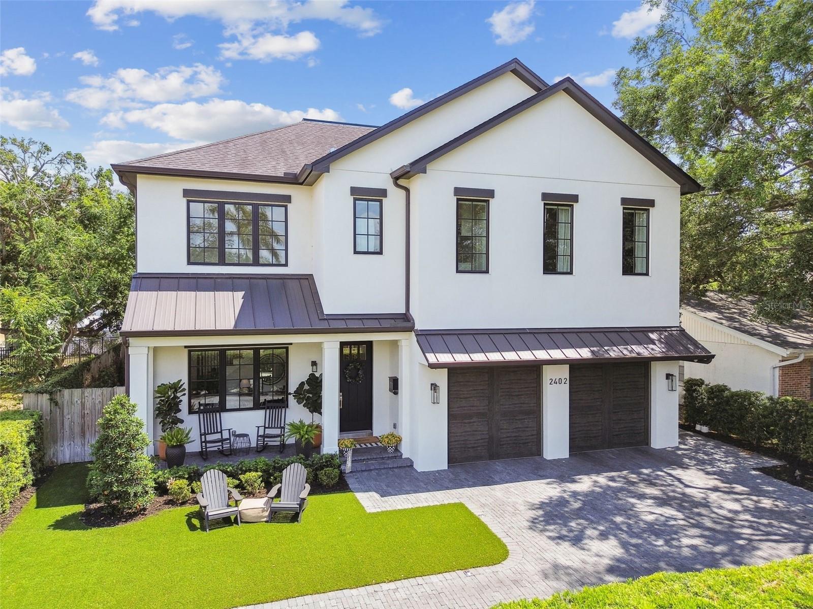 Form meets function at this like-new (built 2019) Parkland Estates pool home has been masterfully crafted to set the standard for luxury living. You won't be surprised that this home was featured on HGTV'S 100 Day Dream Home! Perfectly situated on a dead-end street in a quiet, walkable neighborhood thoughtfully designed for no through traffic but at the cusp of all the best South Tampa has to offer. All-block construction, soaring ceilings, elongated hallways, wood work details, top-of-the-line appliances, materials and finishes give this custom home elegance and character. The two-story foyer is drenched in natural light, highlighting the marble floors and wainscoted feature wall. Down the hallway, past the fifth bedroom and full bathroom, you are met with an expansive open-concept living space that is sure to impress. The living and dining areas are seamlessly connected to the gourmet kitchen fit for master chefs and celebrities alike. Featuring double islands, marble countertops, equipped with Sub-Zero and Wolf appliances, and anchored by an heirloom La Cornue gas range and hood. A dry bar with Sub-Zero wine refrigerator and Butler’s pantry with additional full-size refrigerator and builtin oven adds a layer of ease and sophistication to hosting and daily life. Upstairs the generously-sized primary suite is a true sanctuary. Through double doors and a vestibule private entry you will immediately feel at ease. Enjoy two large walk-in closets with custom build-outs, and a marble-clad primary bathroom including a freestanding soaking tub, zero-entry shower, dual vanities, and a private water closet. Three additional bedrooms upstairs—each with their own unique en suite bathrooms and walk-in closets—offer luxurious accommodations for family and guests, while a laundry room with an oversized sink and double washers and dryers adds everyday convenience. Outside is your resort-style backyard with a brand-new (2023) salt-chlorinated heated pool and spa, complete with tranquil light and water features. Under the covered lanai, unwind by the gas fireplace, enjoy al fresco dining, or cook in the fully equipped outdoor kitchen. The all-turf landscaping means low-maintenance living and more time to simply enjoy this thoughtfully curated outdoor oasis. All of this in one of Tampa’s most desirable locations— the Mitchell-Wilson-Plant school district and just moments from Hyde Park Village, SoHo, Bayshore Blvd, Downtown. Schedule your private tour today and make your family’s dream a reality.