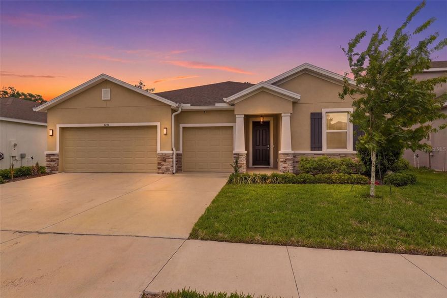 Welcome to 3787 Autumn Amber Dr, a thoughtfully designed 4-bedroom, 3.5-bathroom home built in 2022 and offering over 2,800 square feet of functional, well-appointed living space in the community of Sterling Hill.
From the moment you step inside, the layout stands out. Designed with both everyday living and flexibility in mind, this home features an open-concept floorplan with a spacious great room and a large kitchen that serves as the heart of the home. Granite countertops, stainless steel appliances, and updated hardware create a clean, modern feel, while the oversized island and seamless flow into the living and dining areas make it ideal for gathering and entertaining.
One of the most versatile features of this home is the private multi-generational suite, complete with its own bedroom, living area, and full bathroom—providing options for extended family, guests, or a dedicated work-from-home setup.
The owner’s suite offers a comfortable retreat, featuring a soaking tub, separate shower, and a large walk-in closet. Two of the secondary bedrooms are connected by a Jack and Jill bathroom, creating a functional and convenient layout, while an additional half bath is ideal for guests.
Granite countertops carry through all bathrooms, and updated fixtures and finishes—including chrome hardware throughout with distinctive accents in select spaces—add a cohesive and polished touch.
Step outside to a screened lanai, creating a comfortable outdoor space to relax or entertain. The backyard is enhanced by a wooded backdrop, offering a sense of privacy and a more natural setting. Additional features include a 3-car garage and gutters already installed for added convenience.
Built in 2022 and maintained in immaculate condition, this home offers the feel of new construction without the wait.
Located within the community of Sterling Hill, residents have access to a range of amenities including clubhouses, pools, fitness centers, sports courts, playgrounds, and more.
Conveniently located near shopping, dining, and major roadways, this home offers a combination of modern design, functional living space, and community amenities.