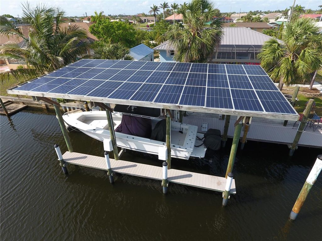 Photo of 107 Sinclair Street SE, Port Charlotte, FL 33952 (MLS # C7519800)