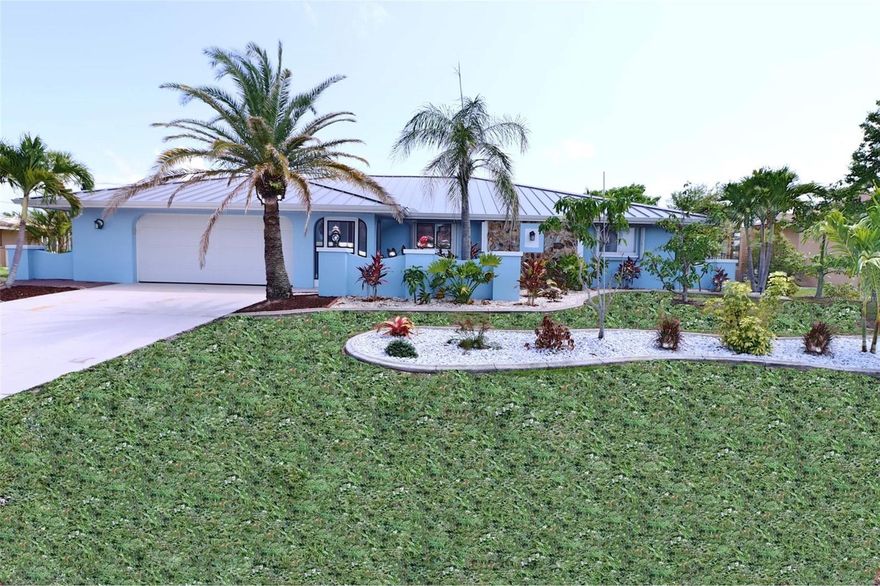 One or more photo(s) has been virtually staged. Sailboat Access & owned Solar System – Fully Remodeled Waterfront Saltwater Pool Home. This stunning 3-bedroom, 3-bath Gulf-access pool home is located in the highly desirable Beach Complex area on the southeast side of town, just a few minutes’ ride to Charlotte Harbor. With deep-water sailboat access, a 13,000 lb boat lift, and additional exterior pier and pilings, it’s truly a boater’s dream. Outdoor Features & Boating Amenities Include: 100 feet of newer PVC sheet pile seawall Large AZEK dock with water, electric, and solar Covered boat lift (13,000 lbs), additional outer pier, and pilings for a large yacht Room for floating docks (WaveRunners or jet boats) The pilings have been left high at the dock intentionally for a possible future two-story Tiki hut. RV parking with 30-amp hookup. Newer 10’ x 20’ shed with metal roof. Accordion hurricane shutters for easy storm protection. Heated saltwater Pebble Tec pool with wet deck. Newer Hayward variable-speed pool pump, Shell Lock paver pool deck with LED lighting and full-view screen enclosure, Outdoor shower, and beautifully landscaped koi pond. Full gutters, privacy landscaping, banana plants, avocado trees, fig trees, and mango trees. Screened front entry. Interior Highlights & Upgrades: Completely remodeled open floor plan. Fresh interior and exterior paint three updated bathrooms New interior doors, trim, and lighting Shiplap plank detail throughout Solid maple cabinetry with quartz countertops Dual cooktops (induction + range) with outside-venting hood Bar with sink, fridge, and dishwasher Porcelain and slate tile in main areas; luxury vinyl in bedrooms Wall of thermal-pane sliding doors New LG French door fridge with dual freezer drawers and two ice makers New Bosch dishwasher and LG large-capacity washer/dryer LED indirect lighting, wood-burning stove Mini-split A/C & heat system for custom temperature control in each room. Updated electrical panel, Energy & Structural Improvements: Standing seam metal roof (2023), 36-panel, 11KW owned solar system (not leased), seven new permitted windows. Full plumbing re-pipe with new overhead PEX lines. Oversized two-car garage with ample storage. This home offers comfort, efficiency, and high-end upgrades throughout. Purchased in August 2023 for $825,000, the property has since seen over $100,000 in additional improvements. This is the home you’ve been waiting for. Brimming with character and overflowing with storage, it offers something most homes don’t- room for everything you love. The thoughtful design and long list of amenities make this home as practical as it is inviting. You won’t have to worry about a failing concrete bulkhead or costly repairs; everything has already been done. Just bring your boats/yachts, water toys, and love for waterfront living. Homes like this are rare, and they don’t last long. Schedule your showing today!