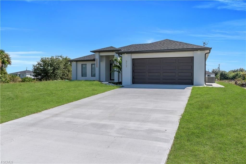 Photo of 312 Pembroke Street, Lehigh Acres, FL 33974 (MLS # A4673301)