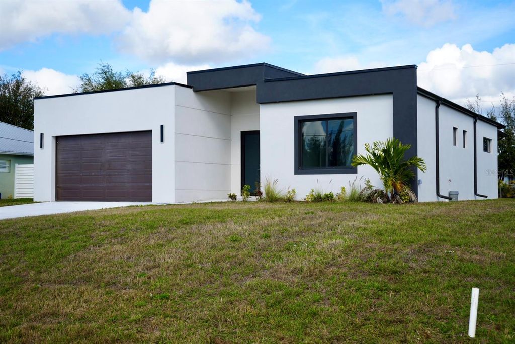 Photo of 313 NE 9th Street, Cape Coral, FL 33909 (MLS # C7509311)