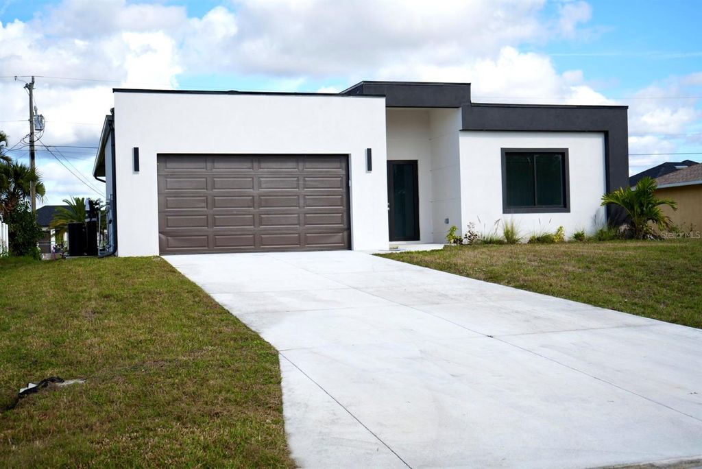 Photo of 313 NE 9th Street, Cape Coral, FL 33909 (MLS # C7509311)