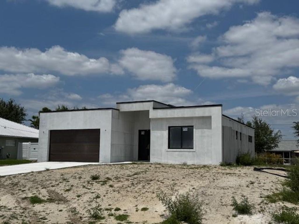 Photo of 313 NE 9th Street, Cape Coral, FL 33909 (MLS # C7509311)