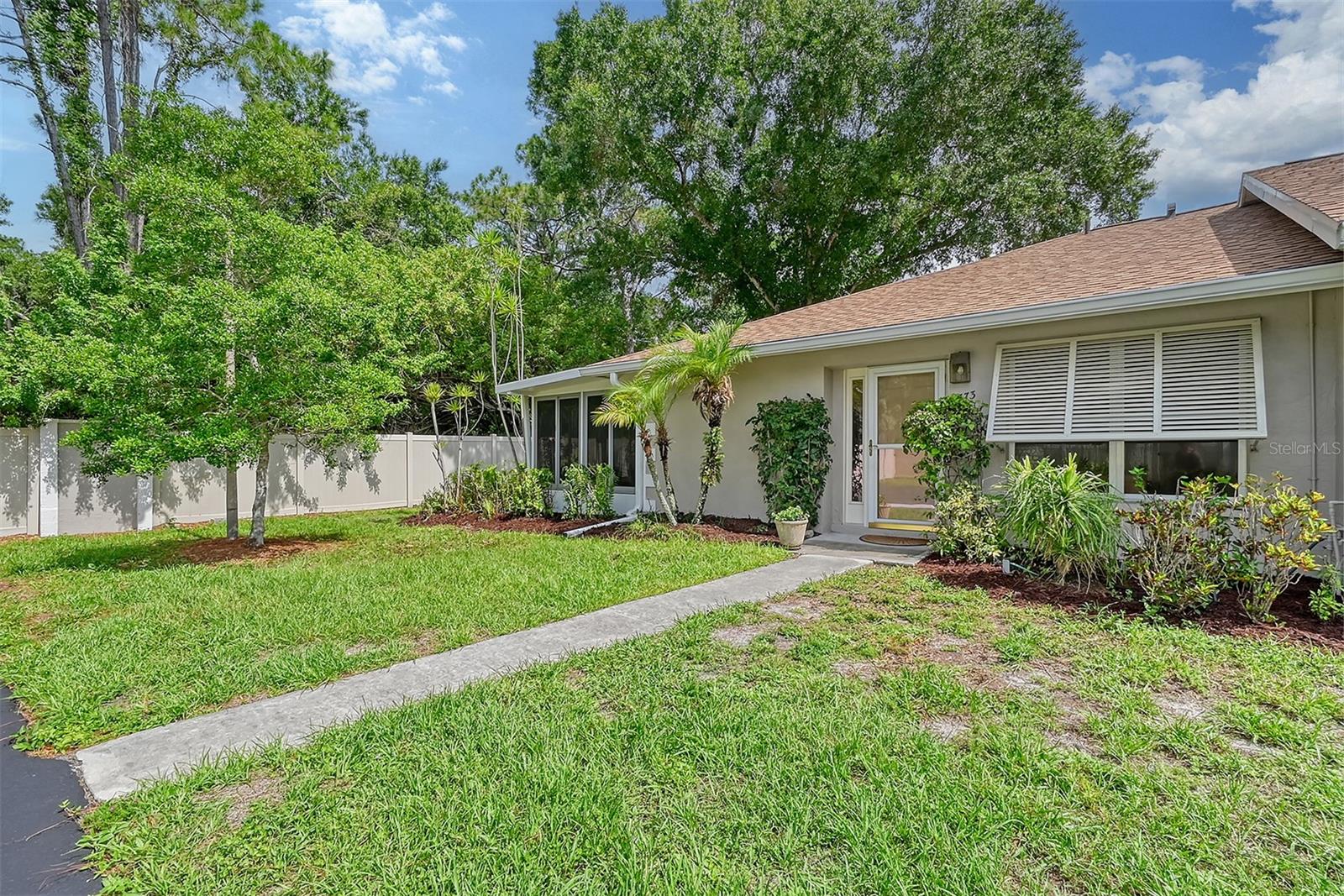 Live the Sarasota Lifestyle – Furnished Villa Available for Short-Term or Annual Rental! Welcome to your tropical escape just minutes from downtown Sarasota! This beautifully furnished 2-bedroom, 2-bath end-unit villa offers the perfect blend of comfort, location, and convenience—ideal for anyone relocating, building, remodeling, or simply seeking a seasonal retreat. Step inside and fall in love with the light-filled interior featuring tile flooring throughout, crown molding, and a spacious open-concept layout. The oversized kitchen offers ample cabinetry, making meal prep a breeze whether you're entertaining or enjoying a quiet night in. The large enclosed Florida room is a true bonus—perfect for a second living area, home office, game room, or even extra guest space! Enjoy lush, tranquil views of tropical greenery right outside your windows and direct access to the heated community pool just steps away—your own slice of Florida paradise. With ample storage for bikes, beach gear, and more, this villa is ready for you to move in and start living your best life. Located less than a mile from Sarasota’s vibrant downtown scene, you’ll be minutes from world-class dining, shopping, the farmers market, theaters, art galleries, the Bayfront, hospitals, Siesta Key Beach, St. Armands Circle, and more. Community fees include water, sewer, trash, basic cable, exterior maintenance, and landscaping for a truly hassle-free lifestyle. Whether you're in transition, planning your next chapter, or just want to enjoy Sarasota for a season, this turnkey furnished villa has everything you need. Don’t miss your chance—schedule your showing today and experience Sarasota living at its finest!