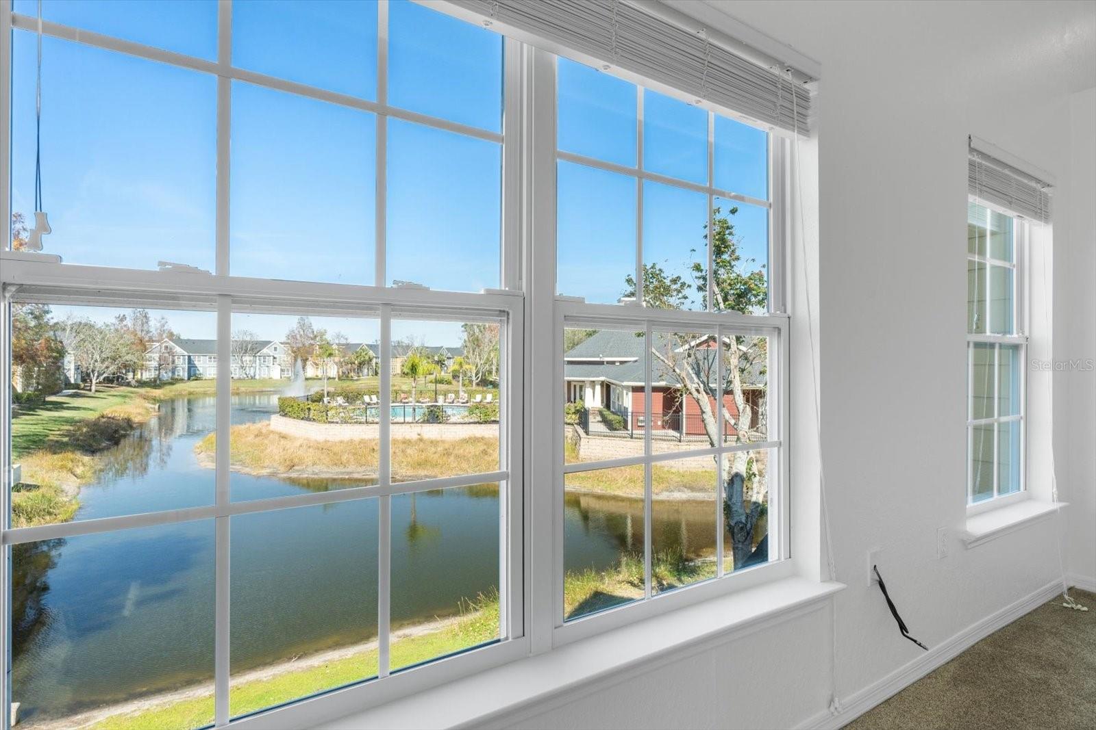 POSSIBLY AVAILABLE TO RENT OR PURCHASE! A-rated school districts! Ashton Elementary, Sarasota Middle and Riverview High. Vacant and move-in ready! Sellers will consider a rental versus a purchase. Large lake view and an oversized one car garage. This light-filled, upstairs, 2 bedroom split plan boasts soaring cathedral ceilings and many upgrades, including a beautifully updated kitchen with quartz countertops and stainless steel appliances, and updated baths, also with quartz countertops. This is a true split plan, with each bedroom having its own en-suite bath and walk-in closet. The entire unit has been freshly painted from top to bottom and the air conditioner and hot water heater are newer. There is a rarely available one car garage included to augment the plentiful open parking for residents and guests. Admirals Walk is a pet and family friendly neighborhood perfect for young professionals, couples, families and empty nesters. Seasonal residents will love the lock and leave convenience and quick access to the Sarasota airport. Be entertained all day by the long lake views showcasing turtles, otters, and a variety of birds. Admirals Walk is a gated community with many amenities including a pool and spa, and a modern clubhouse with a fitness center, game room, conference room and event kitchen. Easy access to I-75, dining and shopping, and only a fifteen-minute drive to world famous Siesta Key Beach. Two pets up to 65 pounds each are allowed by owners. A perfect purchase for yourself or for long-term rental income.