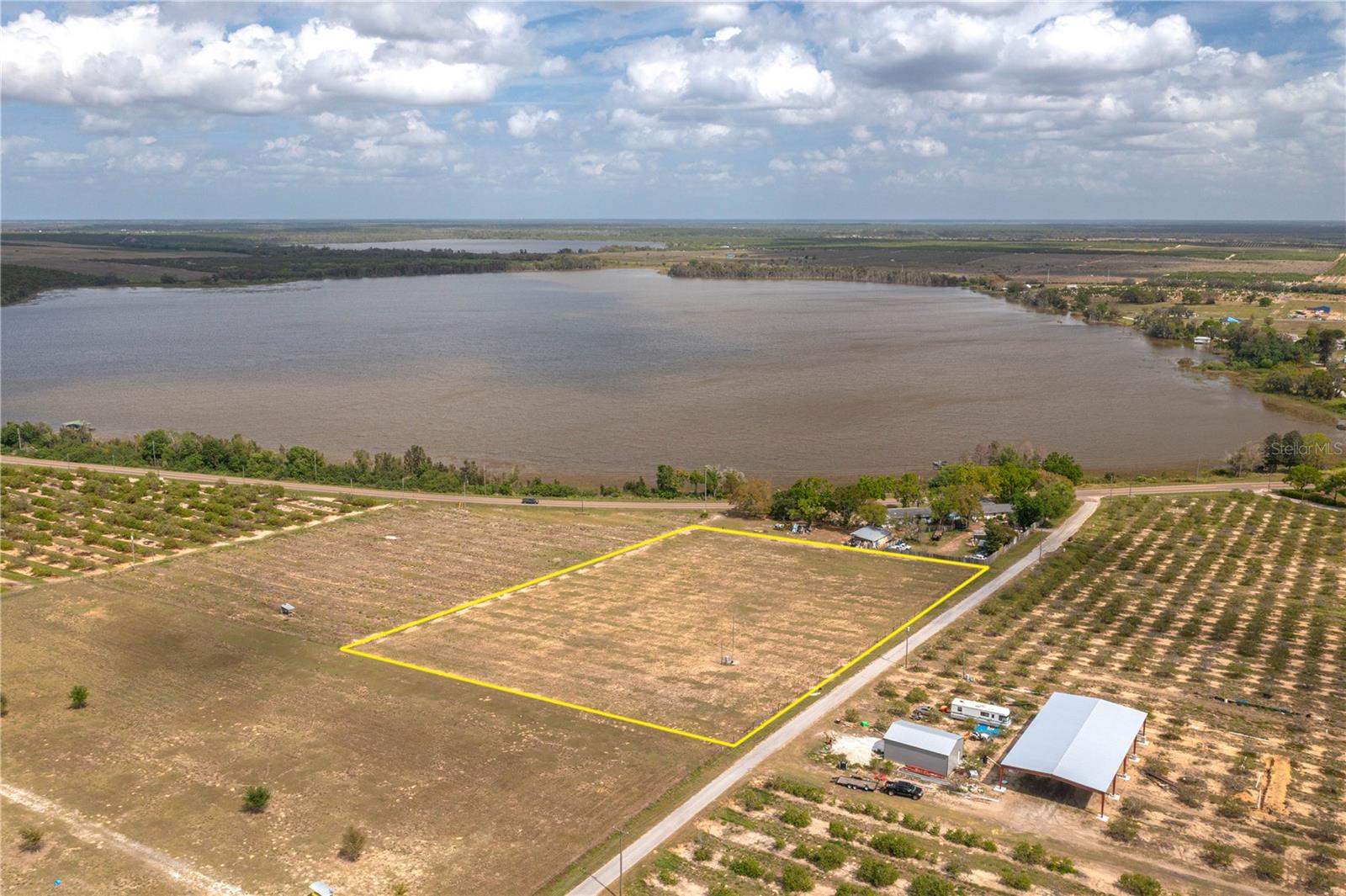 Price Improvement! 3+ Acres overlooking Lake Moody! Discover the perfect canvas for your dream home on this 3.47 acre property, offering peaceful country living with no HOA restrictions. This cleared and fenced land is ready for development, with a well and electric already in place - saving you time and money. Enjoy beautiful views overlooking Lake Moody. Whether you're looking to build your forever home or invest in land, this property provides the perfect blend of nature and convenience. You'll love the convenience of this great Central Florida location just an hour and a half from either coast and beaches. And if you like to boat or fish Polk County has over 550 lakes and lots of excellent fishing.