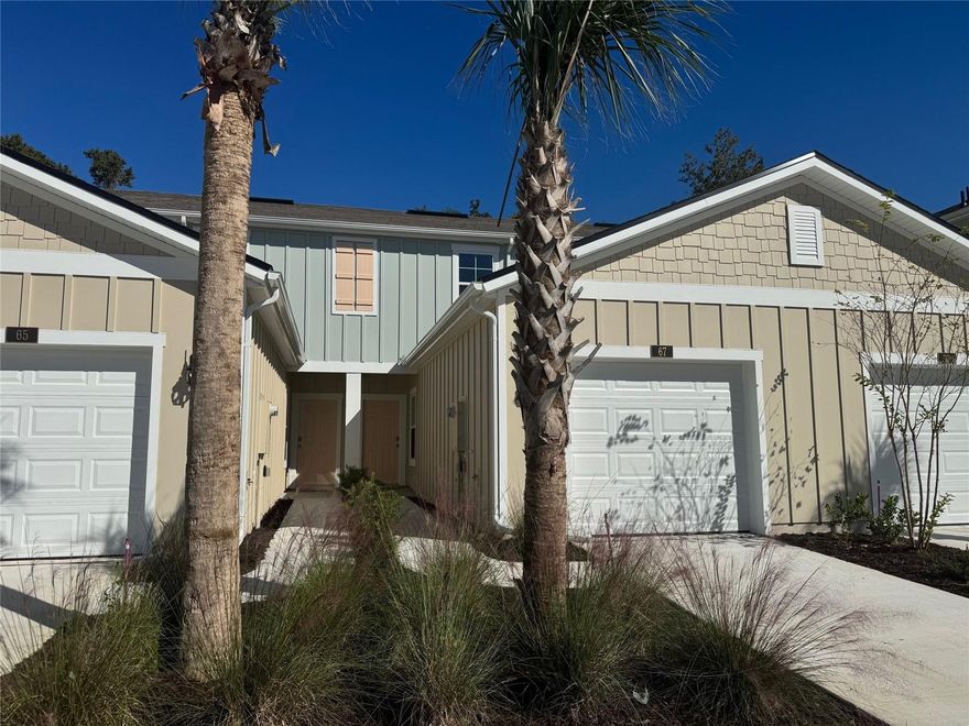 QUICK MOVE-IN! Welcome home to the Aspen! This Tradition Series townhome offers the perfect combination of efficient design and modern style in a 2-bedroom, 2.5-bathroom townhome with 1,210 square feet of well-planned living space and an attached 1-car garage. Ideal for first-time buyers, downsizers, or anyone seeking low maintenance living without sacrificing comfort, this home checks all the boxes. Step inside and you’ll immediately notice the thoughtfully arranged main living area. A spacious kitchen with bar for entertaining has proven to provide plenty of cooking space and room to gather. The kitchen flows into a quaint dining area and inviting living room, creating a welcoming space for family and friends. Oversized sliding glass doors open to a cozy patio, offering a breezy outdoor escape to unwind and soak up the Florida sunshine. Upstairs, two generously sized bedrooms each have their own private bathrooms, making this plan a great fit for a roommate setup, guests, or a home office. Both bedrooms also feature roomy walk-in closets for added storage and organization. Built with energy efficiency and lasting quality in mind, The Aspen is available in sought-after communities throughout North Florida and delivers the style, function, and simplicity today’s homeowners are looking for.