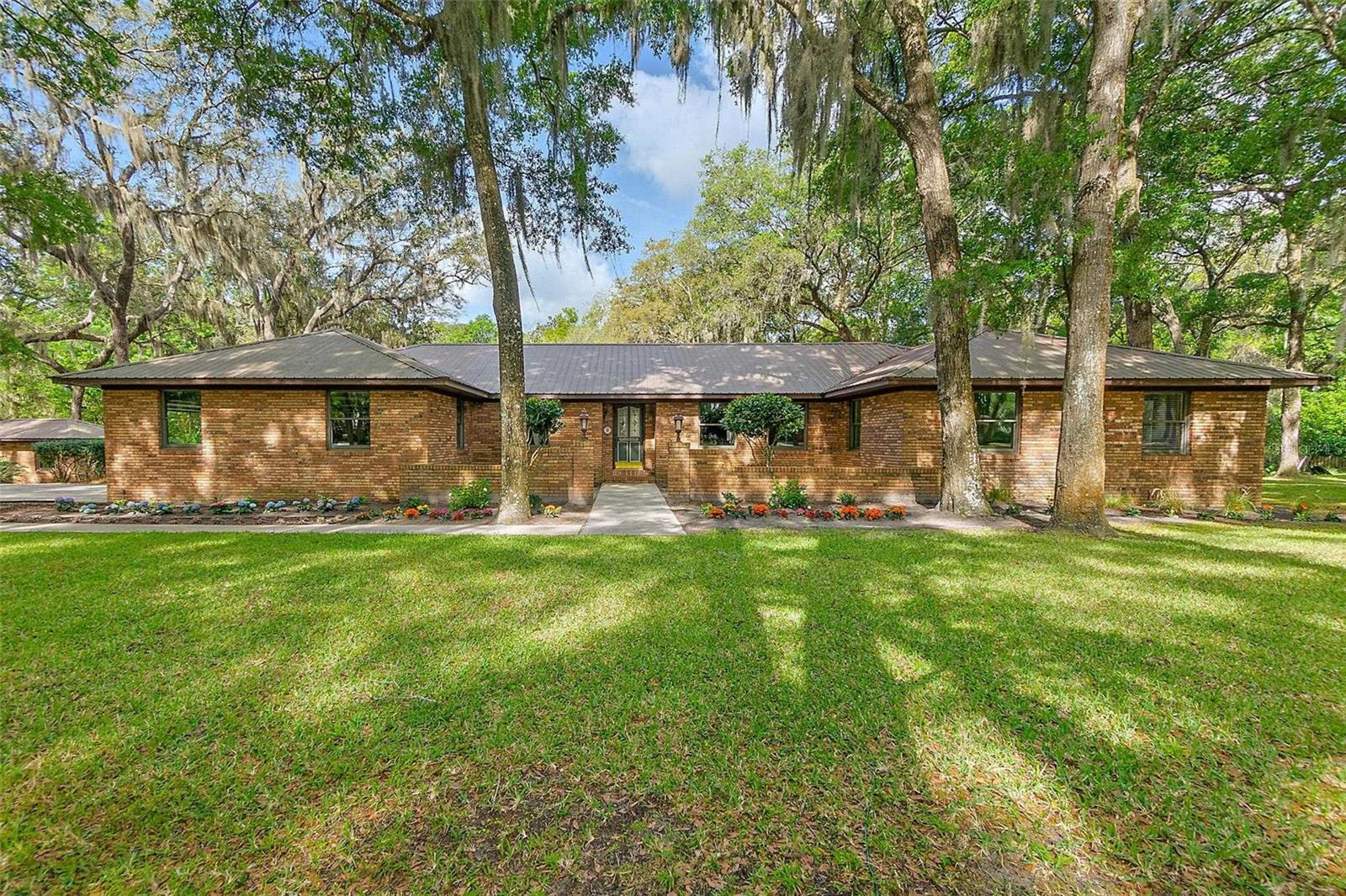Lovely Prairie Creek gated community with 24 hour gate keepers. Home is set under a canopy of majestic oak and ornamental trees lining the neighborhood on 1.2 ACRE LOT WITH PRESERVE AND CREEK BACKDROP! Very private in a great quiet upscale neighborhood. A real St Augustine gem. A rare find close to historic downtown, sandy beaches, fabulous shopping and best rated restaurants. Spacious open floor plan with over 3000+sf 3 bedrooms and 3.5 baths all on the same level. Cathedral ceiling in the oversized master bedroom with auto-light walk- in closets, Jacuzzi and sauna. Wood burning fireplace in the family room. Modernized recently updated extra-large kitchen/dining area, new counter stove-top, in wall oven, abundance of cabinets and counter space. Skylights in dining area overlooking crystal clear pool and preserve! Large screened outdoor entertaining decks surround the pool! Newer refrigerator, newer freezer, newer washer and dryer, newer dishwasher, two new A/C units and updated air handlers, one new and one updated hot water tanks. Anderson insulated impact windows. Five years new eighty year warranted metal roof. Oversized two and a half car garage. Generator hook up. Home is built on a whole house crawl space, not sitting on a slab. Solid real brick exterior. New 200 ft artesian well. Prairie Creek runs along the entire backyard boundary line. Preserve cannot be developed. Additional 1.1 acre abutting approved building lot is available.
