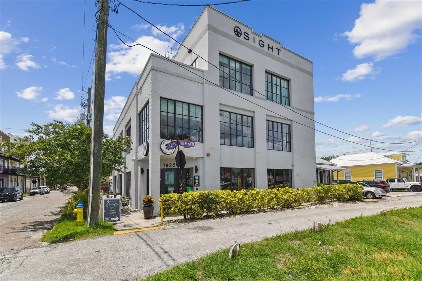 For Sale – Income-Producing Commercial Property in the Heart of Historic Ybor City. Step into an exceptional investment opportunity with this three-story income-producing block building ideally located in the heart of Tampa’s vibrant Historic Ybor City. With unmatched character, versatility, and built-in revenue potential, this property is perfectly positioned for an owner-user or investor seeking a premier commercial asset in one of Tampa’s most sought-after districts. The first floor is designed as a fully operational coffee shop, with fixtures and equipment that convey with the building, making it turnkey-ready for continued food and beverage use. This level also includes a private meeting room, designated parking spaces, and the benefit of wet-zoned, adding even more potential for hospitality or retail operations. The second floor is dedicated to professional office spaces, featuring 11 private office suites, a large conference room, and a kitchenette. This level is ideal for tenants seeking a professional environment in the heart of a thriving business district, with the added convenience of private elevator access. The third floor offers a bright, open office concept perfect for collaborative work environments. It also includes three private offices, an oversized kitchen with a breakfast bar, and a private balcony overlooking Ybor City — creating an inviting mix of functionality and modern workplace comfort. Like the second floor, it benefits from secure elevator access. Call today to schedule a private showing!
