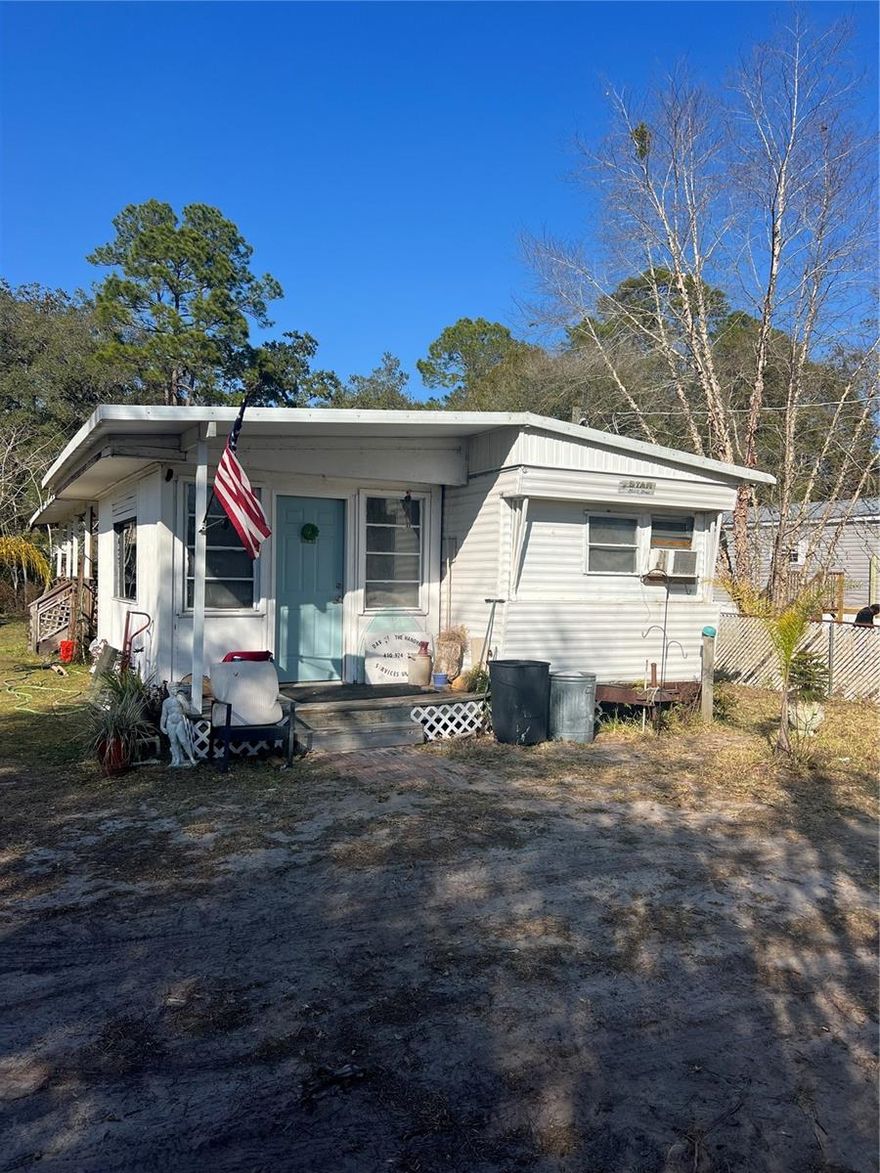 If you have been looking for a Florida retreat near the World's Capital of Bass Fishing in Welaka - look no further! This property has sixty five feet of canal frontage on Dunn's Creek that is fully navigable to the Atlantic Ocean. Putnam County is awaiting the arrival of the massive resort in development by Bass Pro which will include camping, resorts, RV hookups, and much more. Dunn's Creek also connects to the St. John's River, which is a wildlife haven with Dunn's Creek State Park close by. This is the perfect spot to make your own. This is for the inspired - looking to take on a project as this single-wide needs lots of love. Window units for a/c, no heat. Cash-only as she does not qualify for financing.