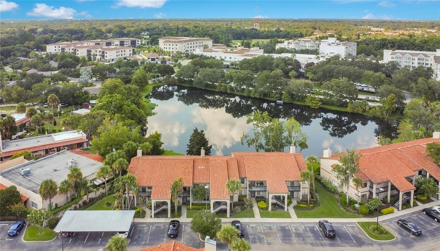 FIRST-FLOOR LIVING WITH DIRECT WATER VIEWS AND AN UNBEATABLE LOCATION! Located in one of Winter Park’s most convenient and cared-for communities, The Gallery at Winter Park. This 2-bedroom, 2-bath condo showcases a beautifully updated kitchen and refreshed bathrooms. Contemporary luxury vinyl floors extend across the bedrooms and living areas for a clean, cohesive look. The primary suite is at the rear of the unit, with French doors opening to the screened-in patio, where you’ll enjoy peaceful water views framed by mature landscaping. The second bedroom, positioned at the front of the home, has its own bathroom, perfect for guests. Additional highlights include an in-unit laundry closet, a covered assigned parking space, and a prime location just across from the community pool. Beyond the home, the location is unmatched: within minutes you’ll find Publix, Sprouts, and tons of dining options.  A short drive takes you to Park Avenue, Rollins College, or major roadways like Semoran Blvd. If you’re looking for low-maintenance living in the heart of Winter Park, complete with water views and walkable conveniences, this home delivers it all! Call us today for a showing!