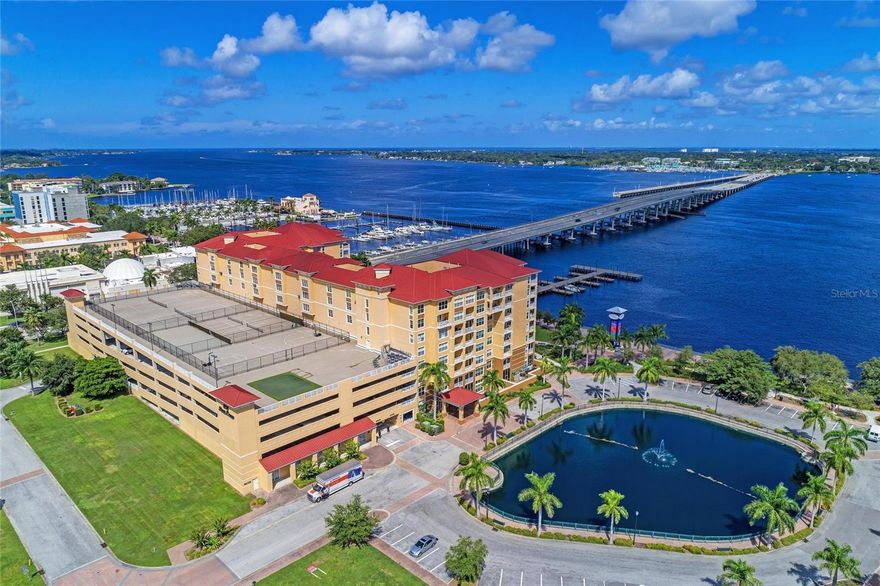 IT'S TIME...Time to trade those cold cloudy days up north for warm sunny skies on Florida's Gulf Coast...Time to sell the snapper and let someone else do the yard work...Time to hit the links, go fishing or take a walk on the beach...Time to finally Make the Move!!! Come take a look at this Affordably Priced Condo and you may find you've finally made the Right Choice! Conveniently located on the River Walk in downtown Bradenton this amazing unit in River Dance features; A spacious Great Room floor plan ideal for entertaining new found friends, and offers a dining area with a view! The cozy kitchen with Gold Stone Granite counters is perfect for creating culinary delights, offers ample storage with 36" oak cabinets, Stainless Steel Appliances (of course), Tumbled Tile back splash, a full size walk in pantry and a breakfast bar ideal for that morning cup of coffee or lunch on the go. The Primary Bedroom features a walk in closet, French door access to the Screened Lanai, luxury vinyl flooring and an ensuite bath with twin sinks, a tub and shower and a private water closet. The Guest Bedroom is separate and private and the DEN/OFFICE is ideal for self employed or those who work remotely. Tile on the diagonal, Crown Molding adds a touch of Class, UPDATED WONDOWS, NEW AC, no deferred maintenance here! Amenities at River Dance include: A HEATED POOL AND SPA, for swimming all season long, a Fitness Center to keep in shape, an In House Theatre with a monthly feature length films for residents, Conference Room, Tennis, Pickle Ball and Basketball courts, Secured Entry, Two apartments in the building for visiting Family or Friends, Covered Gated parking and this unit (one of only four in the building) even has an EV ELECTRIC CHARGING STATION!!! Easy access to the RIVER WALK is perfect for walking or an occasional run, Day Docks adjacent to the property make private boating a pleasure and easy to enjoy, Fine Dining is a short walk away and there's even access to the City owned WATER TAXI for a quick trip out to Anna Maria Island. The BEACHS are calling your name...This is your year so call today and start home tomorrow.