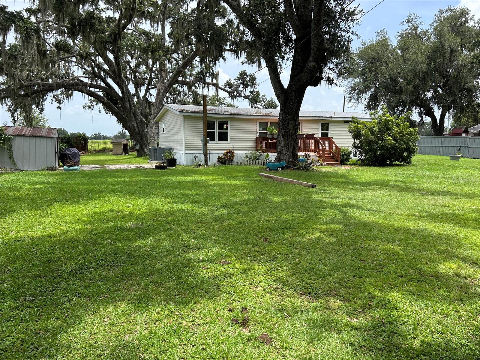 Located on a quiet country side road, and conveniently located between Orlando and Tampa, you'll find this quaint 3 bedroom, 2 bathroom home with 1248 square feet and .42 acres of land. With NO HOA OR CDD your work vehicles and toys are welcome. Minutes to downtown Plant City where you will enjoy the amenities of a true family built community which supports family owned restaurants and shoppes. Amenities/upgrades include: metal roof rebolted 2024, skirting around home 2023, HVAC including new duct work 2022, new well pump and pressure tank 2022, granite kitchen countertops, new toilets. Schedule your showing today.