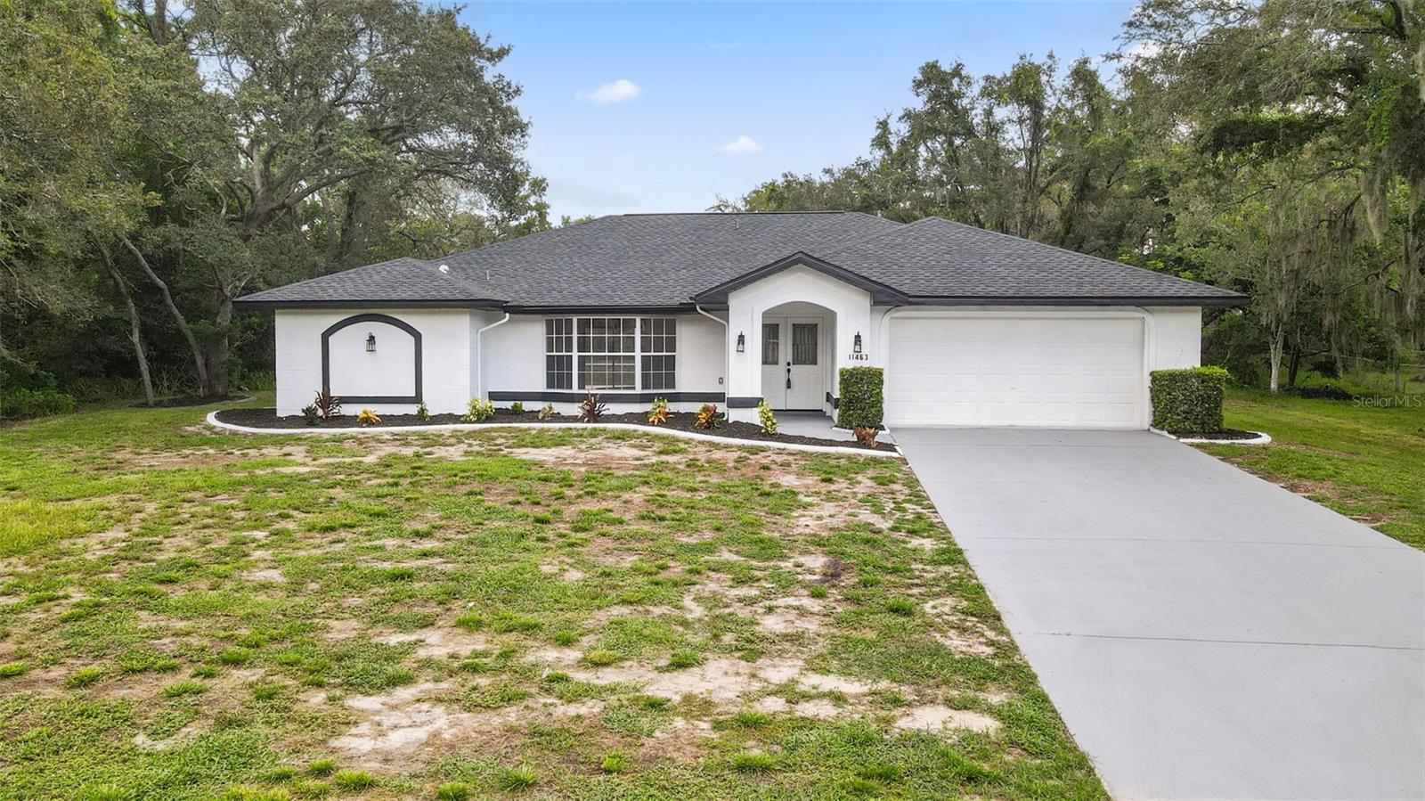 One or more photo(s) has been virtually staged. Welcome to your dream home! This stunning 3-bedroom, 2-bathroom pool home features everything you've been looking for with the perfect blend of modern updates and spacious living, all situated on over half an acre of land.
Step inside to discover fresh interior and exterior paint, newly textured ceilings and walls, all-new luxury vinyl flooring and updated lighting throughout. The updated kitchen is a showstopper, featuring a waterfall island with quartz countertops, new stainless steel appliances, and an inviting eat-in area with a charming bay window overlooking the sparkling pool. Enjoy multiple living spaces with a split floor plan that includes formal dining, a cozy family room, and a spacious living room.The primary suite features a walk-in closet and a stunning en-suite bathroom with dual quartz vanity and walk-in tile shower. Bedrooms 2 and 3 share an updated full bath with stylish tile work. Step outside to your private oasis with a resurfaced screened-in pool, relaxing jacuzzi, fenced yard, and a storage shed. Major upgrades include a brand new roof (2025), water heater (2025), new pool pump(2025),and epoxy-coated garage floor. Not in a flood zone and no hoa fees. Conveniently located just 15 minutes to the Suncoast Parkway and 20 minutes to Weeki Wachee River. Close to shopping, restaurants and much more! Hurry and schedule a showing today!