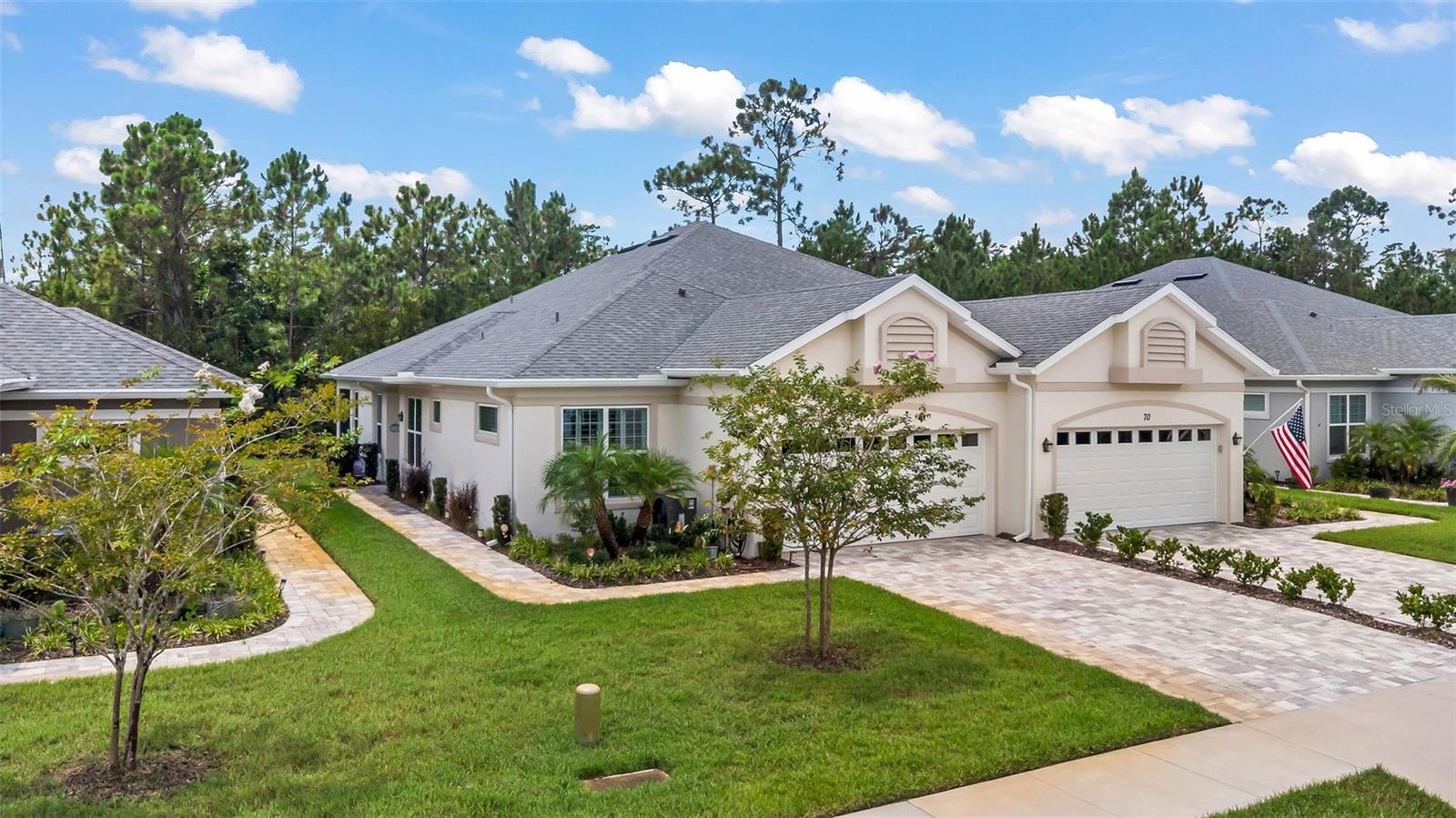 Modern Luxury Meets Low-Maintenance Living in This 2022 Huntington Village Villa Tucked within the peaceful 55+ enclave of Huntington Village in Hunters Ridge, this beautifully built 2022 Chenille model by Platinum Builders offers effortless elegance, privacy, and convenience. Thoughtfully designed with high-end finishes throughout, this villa features over 1,600 square feet of open living space, including two spacious bedrooms, two full bathrooms, a versatile den, a two-car garage, and a tranquil covered and screened lanai overlooking a slice of peaceful paradise! Inside, you’ll find a soothing neutral palette, wood-look tile flooring throughout (no carpet!), and refined touches like tray ceilings and plantation blinds. The heart of the home is a chef’s dream, an oversized island anchors the kitchen, surrounded by 42” soft-close cabinets, granite countertops, a custom tile backsplash, and sleek stainless-steel appliances. Step out onto the screened back porch and find your own private escape. Overlooking a peaceful, tree-lined preserve, this outdoor living space offers the perfect place to start your morning with coffee, listen to the birds, or unwind in the evening with a glass of wine. Whether you’re entertaining or enjoying quiet moments alone, the natural backdrop creates a sense of serenity that’s hard to find, and impossible to forget. Built for long-term comfort and performance, the home includes R-30 attic insulation, low-E double pane windows and slider, core-foam filled concrete block walls, wide and reinforced footings, and a 10-year structural warranty. A 200-amp electrical service, multiple GFI exterior outlets, comfort-height toilets, elevated vanities, Moen fixtures, and an indoor laundry room add convenience and function to match the home’s beautiful form. These energy-efficient systems contribute to below-average utility and homeowners insurance costs, keeping both maintenance and monthly expenses low. Beyond the home, the HOA provides true lock-and-leave living. Fees cover cable TV, high-speed internet, full exterior maintenance (including repainting every five years and annual pressure washing), lawn care, tree and shrub trimming, pest control, termite bond, irrigation, and insurance on the building and roof. Homeowners only need to carry an HO6 policy for interior contents. Residents enjoy access to a private 55+ community pool, as well as all of Hunters Ridge’s resort-style amenities, additional pools, tennis and basketball courts, a clubhouse with year-round events, a fishing pier, and did we mention BINGO?! Nothing quite like jumping into your golf cart and heading to the pool! Bring some burgers and grill dinner poolside! The tropical life awaits you! This turnkey villa checks all the boxes! Not only will humans and pets feel right at home, but your wallet will feel the love too. Close to highway, shopping, dining, hospitals, places of worship, the Worlds Most Famous Beach, parks, river, tourist attractions, Nascar, cruise terminals, airports and so much more! Ormond Beach is a never-ending city with a lot to offer a little something for everyone's taste! This home and community are ready for you to make them home! All information and measurements obtained from the tax roll and seller and while deemed reliable, cannot be guaranteed.