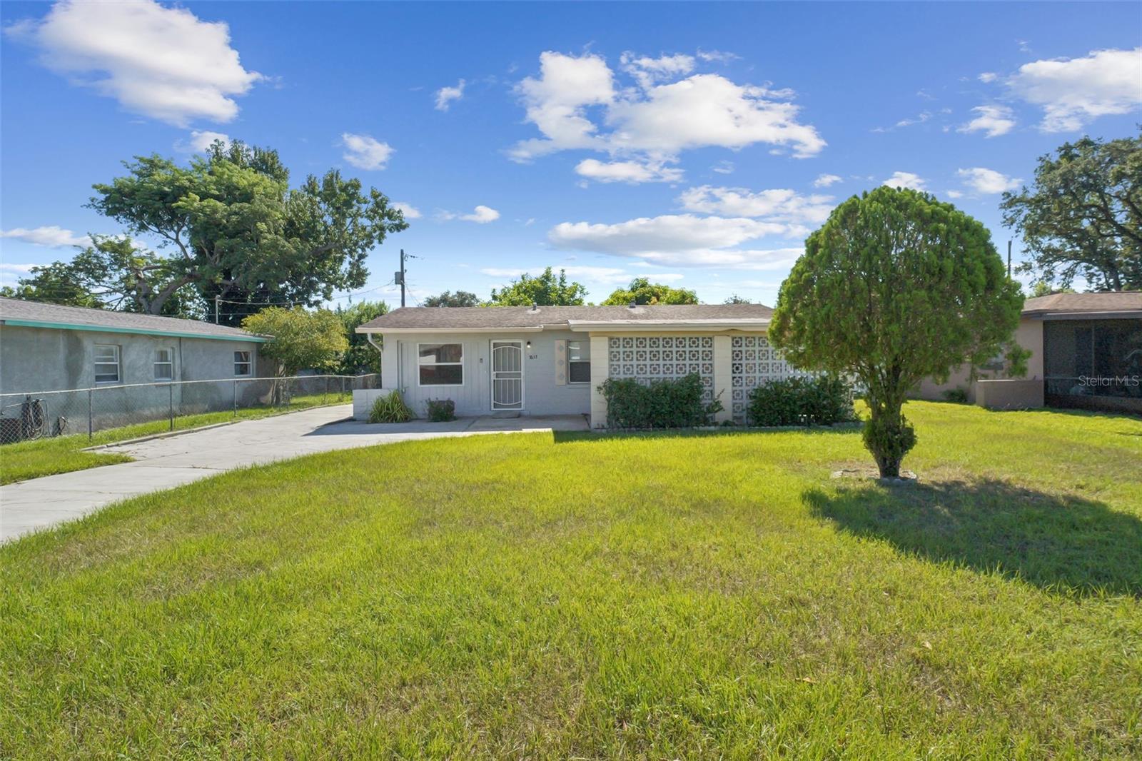 Welcome to 7617 Udine Avenue, a beautifully maintained home nestled in the desirable Tangelo Park community of Orlando. Perfectly situated just minutes from International Drive, major highways, theme parks, shopping, and dining, this home combines everyday convenience with the comfort of a peaceful neighborhood setting. Inside, you’ll find a bright and inviting floor plan with spacious living areas designed for both relaxation and entertaining. The kitchen offers ample cabinetry and counter space, making it ideal for home chefs. Each bedroom provides comfort and versatility, while the bathrooms are thoughtfully updated for modern living. Step outside to enjoy a private backyard with plenty of room for gatherings, gardening, or simply soaking up the Florida sunshine. With a spacious driveway and mature landscaping, this property offers excellent curb appeal and functionality. Whether you’re searching for a first home, a downsizing option, or an investment property with strong rental potential, this residence is a must-see.