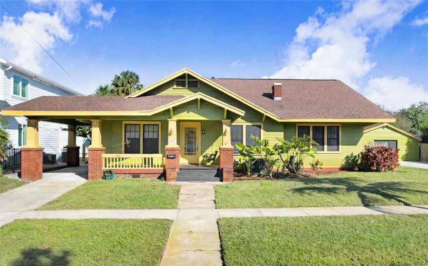 Step into timeless charm with this 1925 Craftsman-style home set on an expansive .23-acre double lot (10,000 square feet) in the heart of South Tampa, offering plenty of room for a pool. Rich with character and thoughtful updates, this three-bedroom, two-bath residence blends early-century craftsmanship with flexible modern living across 2,312 square feet. The inviting living room showcases the original fireplace, while classic details such as original crystal doorknobs and a charming front porch with swing reflect the home’s historic appeal. A formal dining room flows into the kitchen with a cozy dinette area, enhanced by fresh interior paint. Over time, additional improvements have expanded the home, including the primary bedroom and bathroom, along with a partial dinette addition, thoughtfully integrated to enhance functionality while maintaining the home’s character. A substantial 2006 addition further expands the living space with vaulted ceilings, a spacious family room, and a striking spiral staircase leading to a loft—ideal for a home office, studio, or creative workspace. The home is supported by key system updates including 2018 and 2025 HVAC systems, a 2017 roof, a 2025 hot water heater, and a hall and pantry electrical panel upgrade in 2025, offering peace of mind while preserving historic charm. Outdoors, enjoy a fully paved, landscaped, and fenced backyard with pavers added in 2020, well irrigation with a new 2024 well pump, and ample space for entertaining or relaxing. Additional highlights include a porte cochere, double driveways, a detached one-car garage with extra storage, and a separate utility room with laundry and storage—rare and valuable features for a home of this era. Perfectly positioned just minutes from Downtown Tampa, Water Street, Tampa International Airport, and an array of top restaurants, shopping, and entertainment, this home delivers the ideal blend of historic character, modern updates, and exceptional urban convenience.