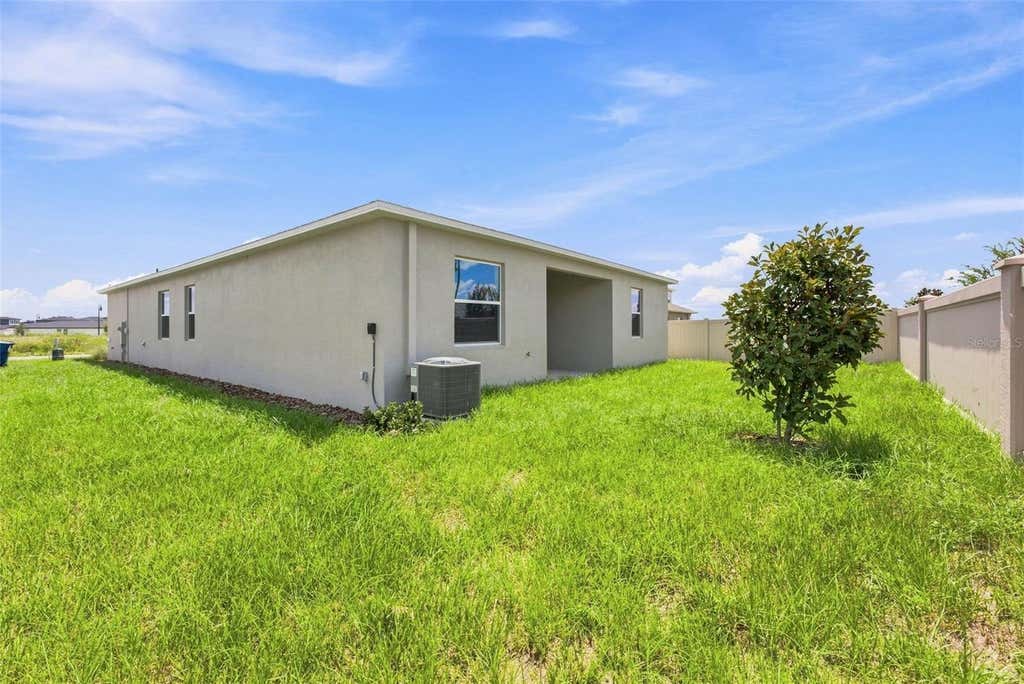 Photo of 5157 Green Belt Drive, Haines City, FL 33844 (MLS # O6433679)