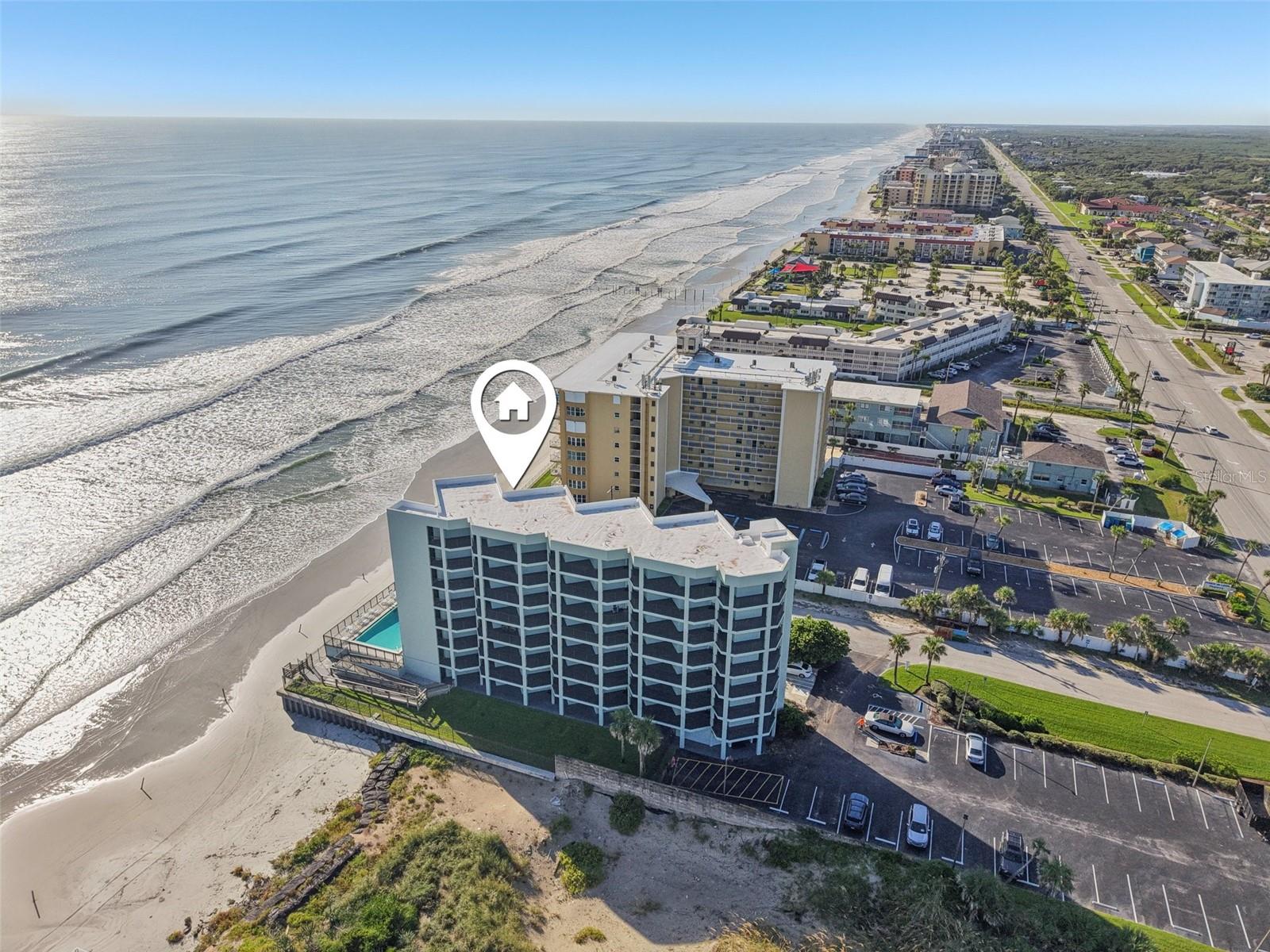 Top Floor with Stunning Ocean Views! Wake up to the sound of the waves and enjoy your morning coffee from a covered patio overlooking the shoreline. This beautifully renovated 1 bed, 1 bath condo is fully turnkey—featuring a brand-new kitchen with granite counters, custom cabinetry, new paint, updated fixtures, appliances, and furniture. You’ll also appreciate the new A/C, hot water tank, and a completely updated bathroom. With ocean views from every room, plus plenty of storage and a private owners’ closet, it’s both stylish and practical.
Ocean Trillium offers fantastic amenities including a beachfront pool, direct ocean access, and all utilities covered in the HOA fee. Recent building upgrades and strong reserves add peace of mind—special assessments are fully paid! Whether you’re looking for a personal retreat or an income-producing rental, this condo is ready for you. Walk to favorite local restaurants like SoNapa and Izzy’s Island Tacos, or simply relax by the water. Schedule your private showing today!