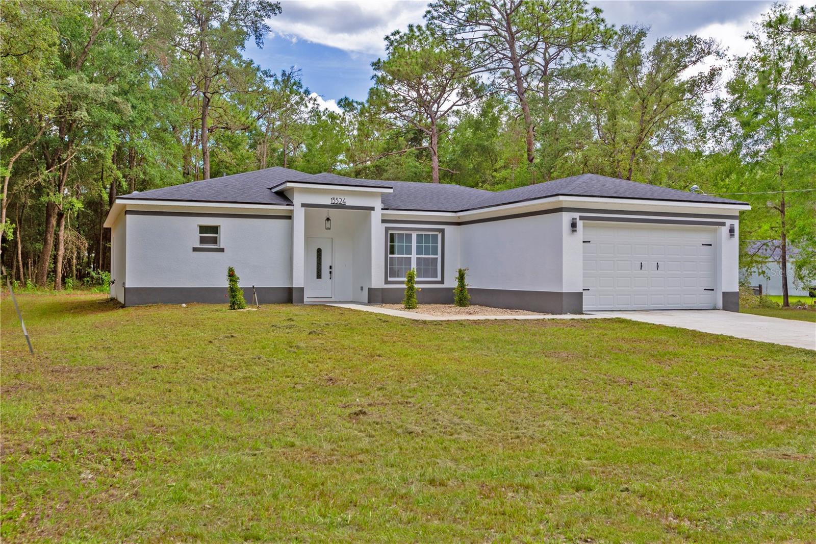NO HOA, OVER 1 ACRE OF LAND, BRING YOUR TOYS AND HORSES!! NEWLY CONSTRUCTED HOME, Nestled in the serene surroundings of Rolling Hills, this spectacular 2025 home invites you with its dazzling charm and over an acre of prime land. Designed for those who crave elegance and functionality, this residence promises a lifestyle of comfort and convenience. Are you ready to explore your dream home? Spacious Layout & Versatile Space Boasting 1648 sqft of living space and 2295 sqft in total, this home provides ample room for a bustling family. With 3 well-appointed bedrooms, 2 pristine bathrooms, and an extra office space that may easily transition into a fourth bedroom, you have the flexibility to tailor the space to your needs. Imagine family movie nights in the cozy living area or working from your peaceful home office overlooking majestic landscapes. Luxury Meets Modern Design This move-in-ready gem is a testament to contemporary craftsmanship, featuring over $15k in luxurious upgrades. Picture yourself preparing meals in a chef’s paradise with 42" solid Shaker wood cabinets, a stylish Quartz island, and European modern faucets that breathe life into every corner. The stainless-steel appliances and beautiful dining area facing serene backyard views make for an enchanting dining experience every day. Attention to Detail The home embraces exquisite finishes with waterproof luxury vinyl plank flooring throughout, inviting you to experience elegance underfoot. The master suite is a sanctuary with a tray ceiling and an impressive walk-in closet. Retreat into a spa-like master bath with a stunning oversized shower, rain-head, and contemporary fixtures. Endless Entertainment Options Situated on a sprawling 1.2-acre plot, this property encourages outdoor adventures and gatherings. From riding ATVs to hosting stellar summer barbecues, your entertainment choices are limitless. Let the children play freely or park your RV – the possibilities are expansive. Convenience & Community Location is key, and this property does not disappoint. Close to essential amenities like nearby supermarkets, chic restaurants, and renowned locations such as the World Equestrian Center, Ocala's charm is just a stone’s throw away.