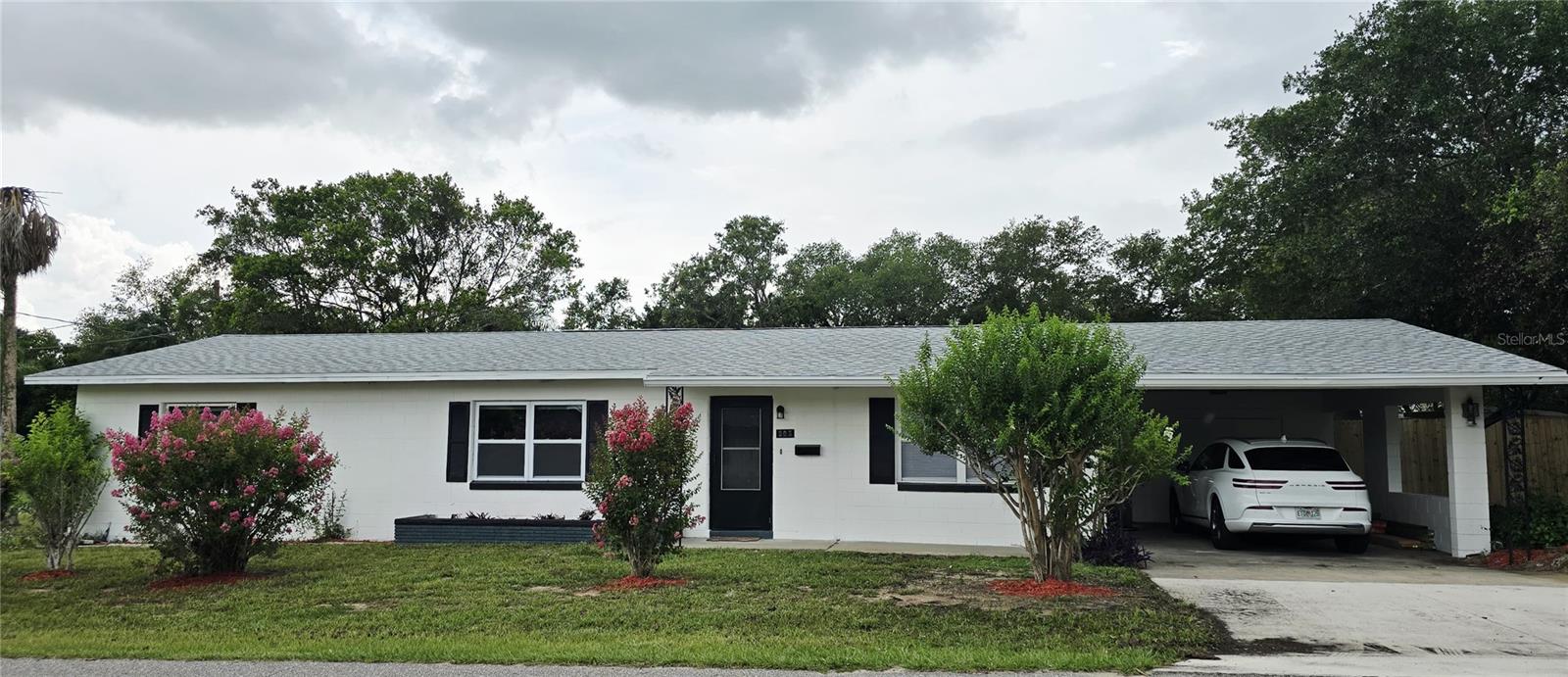 Fully updated 3/2 block house in an enlarged corner lot, fully fenced in a safe and quiet neighborhood walking distance to the lake and downtown with no HOA! NEW, NEW NEW! Roof, AC with latest R30 freon, kitchen, Calacata quartz countertops, vanities, shower, LVP floors, Water heater, stainless steel appliances. Carport with large storage room plus 2 sheds in the backyard. Make this your home free of restrictions