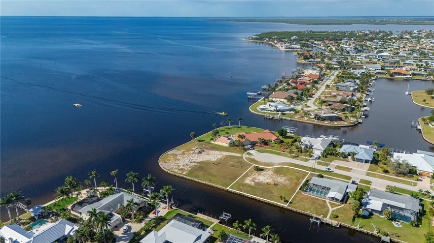 Tucked along a tranquil saltwater canal with 110 feet of waterfront, this rare .32-acre lot captures the essence of Southwest Florida coastal living. Just ONE LOT in from open water, you’ll enjoy DIRECT, sailboat-accessible passage to Charlotte Harbor and the Gulf of Mexico-no bridges, no limits. Here, your backyard becomes your gateway to adventure-world-class Tarpon fishing, island hopping to Boca Grande, and sunset cruises along Port Charlotte Harbor. Design your dream retreat on a large homesite with room for a pool, multi-level home, or spacious outdoor living area-and with no deed restrictions, your vision can flow as freely as the tide. Beyond the dock, everything you love is nearby: Englewood Beach for quiet walks along the sand, the Charlotte Harbor Yacht Club for sailing and social gatherings, and Fishermen’s Village for shopping, dining, and waterfront entertainment. Punta Gorda Airport is just 15 minutes away, keeping travel easy yet keeping you close to paradise. Whether you’re drawn by the fishing, the freedom, or the lifestyle, this location brings it all together- a rare piece of land where life unfolds by the water, and every day feels like vacation.