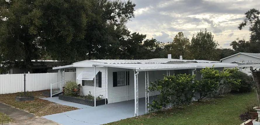 Finances Available, No Lot Rent, No HOA. Your dream home awaits in this beautifully maintained mobile home, situated on a massive lot in the heart of Port Orange! You'll enjoy the prime location just minutes from US-1, I-95, and I-4, providing easy access to beaches, Daytona Beach, and Ponce Inlet. Inside, you'll find a spacious interior featuring 2 bedrooms and 2 bathrooms, with a beautiful floor plan and updated amenities like new ceiling fans and a newer A/C system, New Ductwork, Newer Water Heater. A versatile bonus room offers the perfect space to set up a home office or use as you see fit. The outdoor space is perfect for a relaxation and entertainment area, a TV, and a hot tub; And with plenty of room on the property, you can even park your RV or small boat, making this home a dream come true for outdoor enthusiasts. You'll also appreciate the ample storage options, including a utility room with washer and dryer, a tool shed, and a 2-car paved carport. With affordable taxes, this home offers a fantastic opportunity to own beautiful property at a great price. Schedule your showing today and make this incredible home yours!