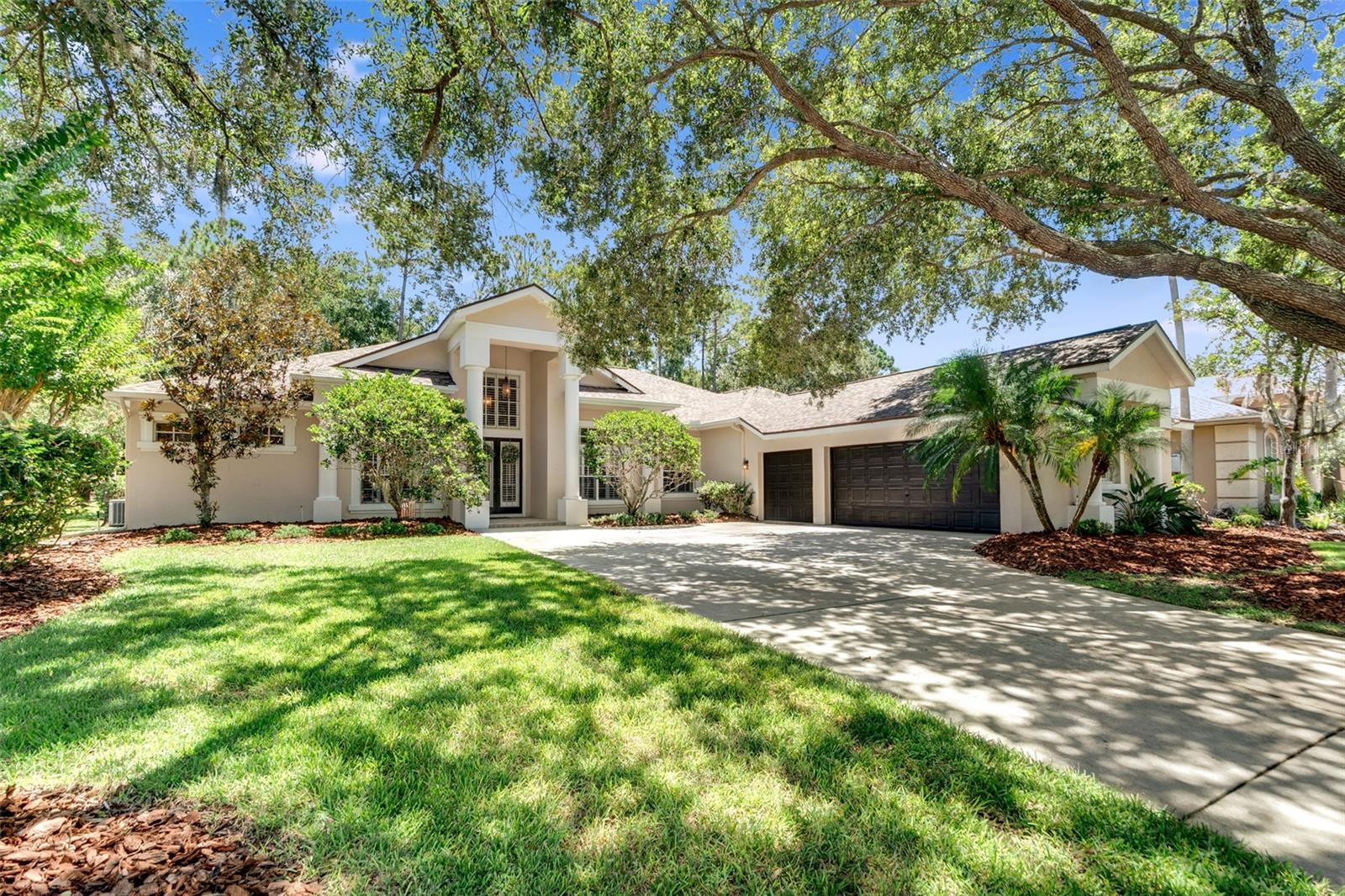 Enjoy the very best in this updated exquisite executive home in Ivy Ridge Section of Lansbrook. Located, just steps to Lansbrook Lakefront Park with private access to Lake Tarpon via a community-only boat ramp. Upon arriving, you will note the cul-de-sac location with the large oak trees out-front leads you into a grand entrance foyer with soaring ceilings, formal living room, dining room, open loft and views of the upgraded giant-size pool with new pebble tec, new solar heated and salt system (2023). The double covered lanai has new brick pavers (2023). To enhance openness, there are quad glass slides in the formal living room and quad glass slides in the family room to completely open the home to the outside. This luxury home has a split floor plan with 4 bedrooms located on the first floor. Need more? The loft and private office can made it 6 bedrooms, if needed. The massive owner's bedroom with king size entry door, tray ceiling, walk-in closet, ceiling fan, and separate French Doors exit to the lanai will not only provide a unique retreat but a place of rest and comfort. The updated kitchen is a chef's dream with huge island, massive white cabinets and drawers, separate pantry, separate storage room area, and bar area that opens to the family room with raised ceiling and wood burning fireplace. The 3 full baths have been completely updated wit new tile, frameless shower door and updated cabinets. the pool's half bath is conveniently located off the pool area. Just a few of the updates include the newer roof (2021). In addition, over $100,000 in updates in the last 2 years including repainting inside and outside (2023), bathroom updates (2023), new ceiling fans (2023), new top of the line plantation shutters for windows and doors (2023), new high end wood floors and new upscale designer ceramic tile floors (2023), new dishwasher and refrigerator (2023), pool and brick pavers (2023) and many more updates too numerous to mention. The 3 car side garage not only has adequate room for 3 cars but a side storage area and attic storage space. All this is located in X flood zone and no flood insurance is required. Homes in this sought-after neighborhood move quickly, so don't miss your chance to own this exceptional home. Schedule your private tour today and make this dream home yours!!