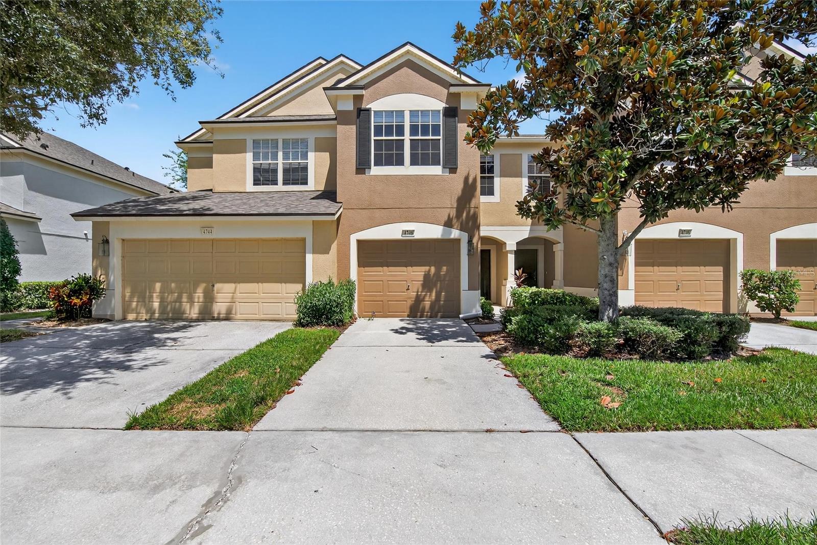 GATED SECURITY, EXTRA PRIVACY, AND SUPER CONVENIENCE! That's what you get with this 3-bedroom, 2-bath townhome with its own 1-car garage and driveway! The security is part of the appeal at Valhalla, a popular choice because of its great location where Riverview meets Brandon. Privacy is enhanced because this home's screened lanai overlooks a backyard fence and a pond, not another neighbor. Then there's the convenience of its spot with nearby guest parking close to the front of the community, within minutes of shops, restaurants, commuter routes and more! Tile, granite, and wood laminate highlight the downstairs kitchen, living and dining rooms. Upstairs, 2 front bedrooms share a hallway bath while the primary bedroom in back includes a bath en suite. Your HOA fee covers Internet, water and sewer bills in addition to grounds, exterior care, and the neighborhood pool. You want to live here!