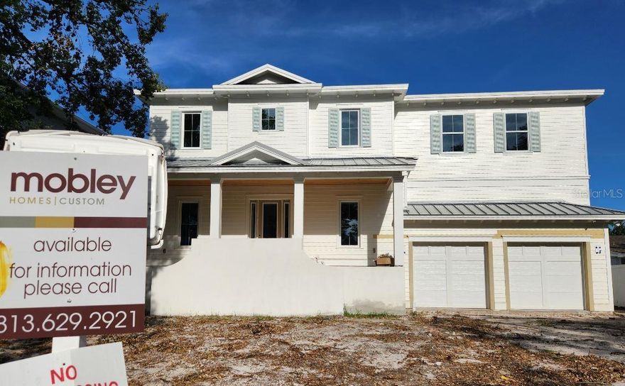 Completed - Mobley Homes Custom 2 story block build including a pool/spa. Davis Islands location 4609 sq ft with an oversized lot and garage. Top quality workmanship and attention to detail, including high ceilings, open floor plan, hardwood floors throughout, marble, gas exterior coach lights, heavy trim package to include 7" baseboards and crown throughout along with upgraded Perrin & Row and Rohl plumbing. The gourmet kitchen includes large island with Ultracraft cabinets, custom Wolf Sub Zero appliances, marble tops/backsplash and butlers pantry. The large walk-in closets will have built in custom shelves included. Interior doors are all solid core and batt insulation is included between floors for sound.  Exterior has wood porch ceilings, sparkling pool and heated spa also included. Walk to all of the shops, great restaurants and parks.