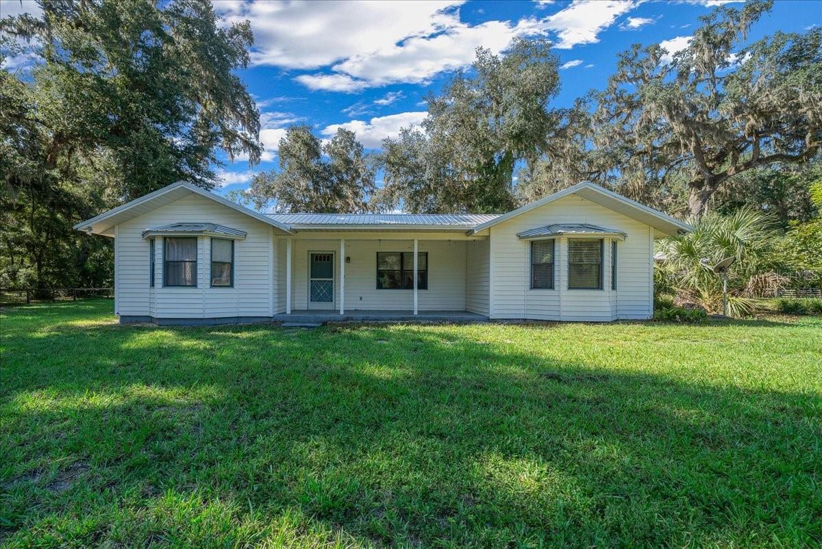 CHARMING 3 BEDROOM 2 BATH FARMHOUSE ON 4.4 ACRES IN ANTHONY!
Nestled beneath majestic granddaddy oaks, only 15 minutes to Ocala, this farm-style home offers the perfect blend of country living and modern convenience. Bring your horses—complete with 3-stall barn, wash rack, round pen, and 3 paddocks. Grow your own garden, collect fresh eggs, and enjoy true farm-to-table living just steps from your back door. Additional improvements include a pump house and storage building, providing plenty of space for equipment and supplies. Enjoy peaceful mornings with sightings of wild deer and turkey right outside your door. With zoning that allows for an additional home (site built, mobile or modular), the possibilities are endless—create a multigenerational retreat, guest cottage, or income property.Whether you’re starting a mini farm or simply seeking a quiet retreat in a highly desirable area of Anthony, this home is a must-see!