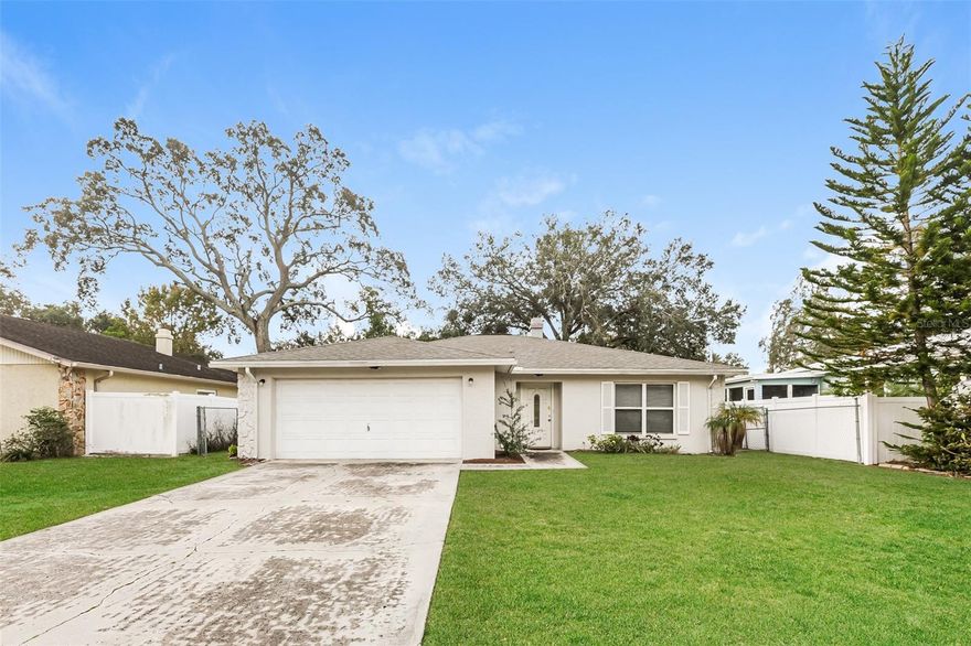 Charm and curb appeal abound for this Tampa home! Step inside into the inviting foyer, past the fireplace and into the well-appointed living room. Through the dining room you'll find the kitchen, which boasts stainless steel appliances, hard surface countertops, and ample storage. Rounding out this ranch style floorplan is the primary suite and two secondary bedrooms. Come and see for yourself the possibilities that this home has to offer!
