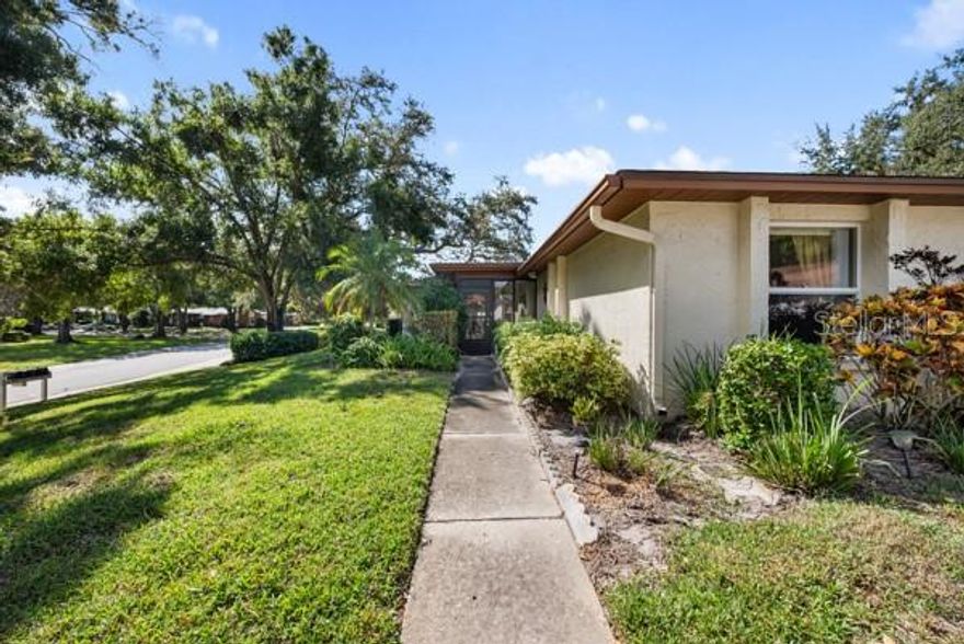 What a warm, welcoming and cozy condo that shows the Pride of Ownership upon entering.  Feast your eyes on the cheerful colors with all neutral ceramic tile throughout  (except Livingroom) and immaculate care and love shown in this condo.  The master bed & 2nd bed have all new windows giving ultimate protection from the elements of our Florida weather.  The a/c is only 7 years old, roof is 1 year ago (association responsibility)breaker box is 1 year old, new refrigerator 2 years old, water heater is 2 months old.  The Family room/lanai offers all windows for light and bright room that extra space for reading or just sitting and relaxing and watching the world go by.  The kitchen is somewhat updated with all white cabinets and colorful blacksplash for accent to the kitchen space. Kitchen appliances newer and well taken care of....The Highland Lakes Community is a well sought after Free Golf Community plus a 55+ community with many Clubhouse amenities with Heated pools and Jacuzzi for relaxation. Sign up for boat tour of Lake Tarpon and lunch at the Tarpon Turtle. You won't be disappointed.  Visit 3300 MacGregor Clubhouse today.  CALL ME TODAY FOR APPT TO SEE THIS LOVELY CONDO.....