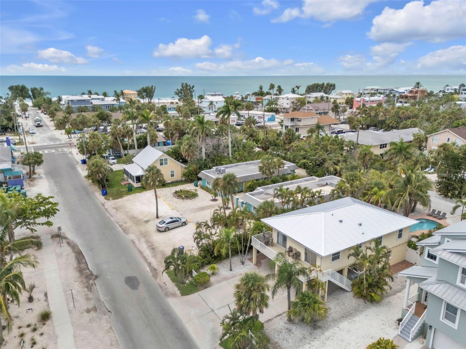 Beach Walks, Pool Days, and Endless Island Living Await. Just a 4-minute stroll to the sandy shores of the Gulf of Mexico, this 3-bedroom, 2-bath elevated home invites you to embrace the relaxed rhythm of life on Anna Maria Island. Whether you’re lounging by the pool, entertaining in the spacious backyard, or hopping on a golf cart for a ride to your favorite local spot, every day feels like a vacation here.
Inside, the home features bright, airy living spaces with durable tile flooring throughout and two newly remodeled bathrooms that blend comfort with coastal style. The elevated design provides not only peace of mind but also a large garage and 4 covered parking spots, giving you plenty of space for beach toys, bikes, and storage. The outdoor space is the heart of this property. A sparkling in-ground pool with all-new equipment. The backyard is surrounded by room to relax, play, or entertain. With a new metal roof (2025), the home is move-in ready yet still offers a blank slate to design your dream retreat. Tucked near the island’s favorite spots, this property delivers both convenience and charm. Currently operating as a successful short-term rental, it’s equally suited as a primary residence, vacation home, or investment property. Life on Anna Maria Island doesn’t get much better than this.