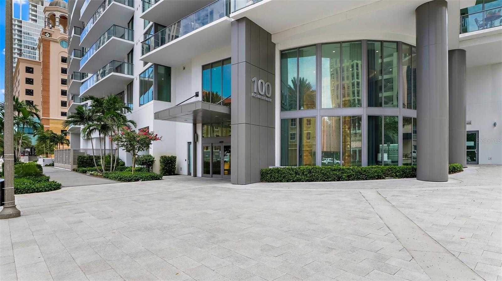 Welcome to ONE St. Petersburg, where modern sophistication meets the best of city and waterfront living. This rare 2-bedroom, 2.5-bathroom residence with an additional den is one of only nine Lumiere corner units, designed to capture sweeping views of both the bay and skyline. With 1,894 square feet of interior space and the building’s largest private terrace, it offers a lifestyle of unmatched elegance and privacy.
Inside, the open-concept design blends comfort and style. The gourmet kitchen features professional-grade stainless steel appliances, sleek cabinetry, and refined countertops, all flowing seamlessly into the living and dining areas; ideal for both everyday living and entertaining on a grand scale. The spacious primary suite includes a luxurious spa-inspired bathroom and an oversized walk-in closet, while the additional bedroom and den provide versatility for guests or a home office. Every detail, from the electric blinds to the designer lighting, reflects thoughtful craftsmanship and modern convenience.
This residence offers a unique ease of living with parking on the same level as the unit. Beyond your private sanctuary, the community elevates the definition of resort-style amenities. Residents enjoy a 40,000-square-foot amenity deck with a 75-foot lap pool, cabanas, a spa, fire pits, and outdoor kitchens. Indoors, you’ll find a state-of-the-art fitness center, yoga studio, club and game rooms with spacious balconies and stunning views, beautifully appointed gathering spaces, complemented by concierge services and curated lifestyle programming.
Perfectly positioned in the heart of downtown St. Petersburg, you are just steps away from acclaimed restaurants, high-end shopping, museums, galleries, theaters, and the waterfront promenade. Whether you’re enjoying a night out, a cultural experience, or a leisurely walk along the bayfront, this home offers the ultimate combination of luxury, convenience, and vibrant city living. Offered fully furnished for convenience and style.