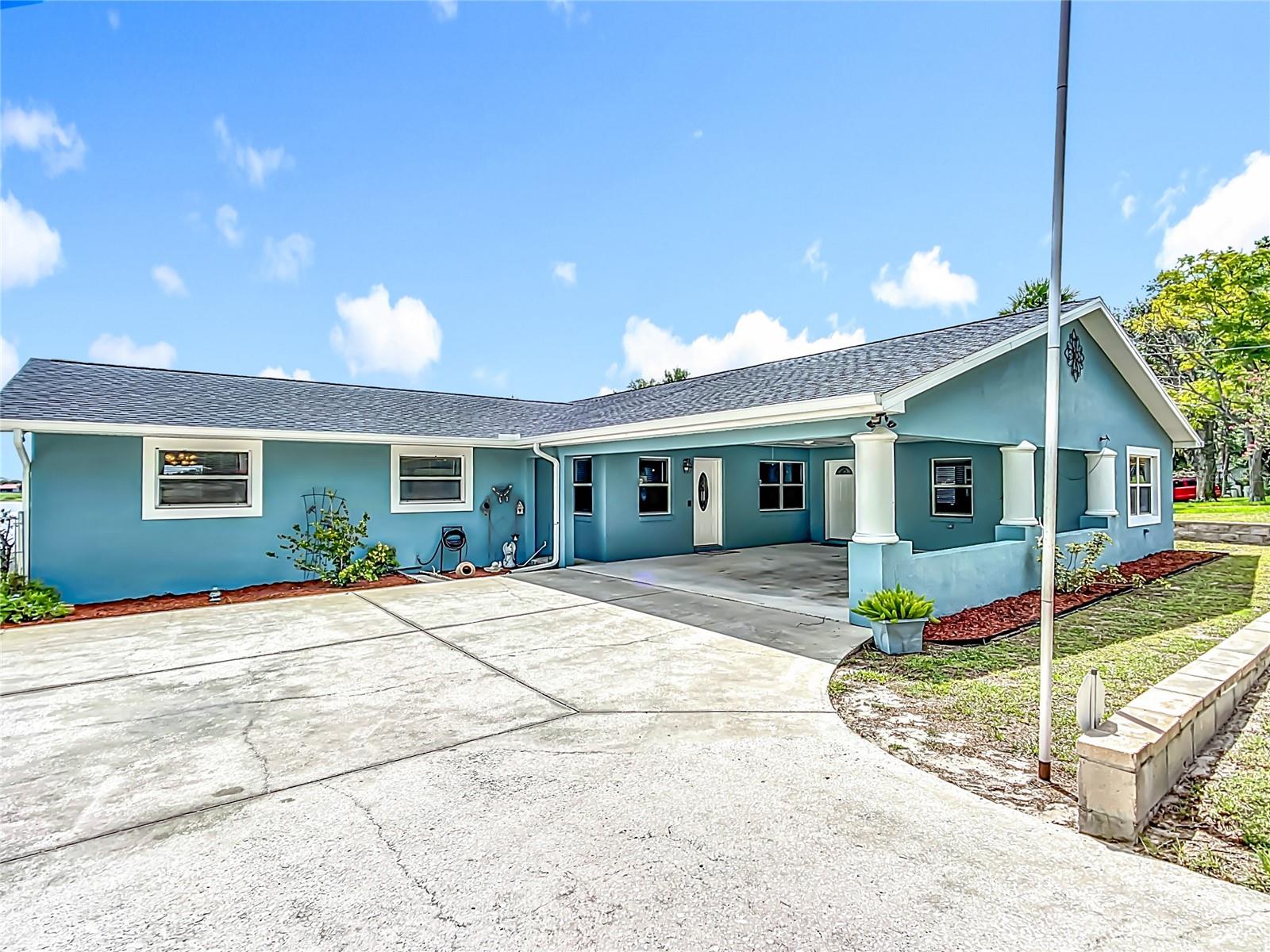Nestled on a forty acre private lake along the Shores of Lake Lucerne, this 3 bedroom 2 bath home offers the ultimate Florida lake front lifestyle.Enjoy boating fishing, jet skiing and all your favorite water activities right from your own backyard. The Home features a newer roof a private well, (no water bill) And a spacious Florida room with breath-taking sunrise views over the lake. Inside, you'll find a welcoming family room with an electric fireplace, Livingroom with lakefront view, kitchen/ dining room combo A versatile bonus room off of the Florida room that can serve as a bedroom/ guestroom complete with bathroom. Home also has an oversized garage/workshop (32 x40), have plenty of room for whatever you enjoy. Concrete driveway with parking pad with plenty parking, bring your water toys. Plus a double carport on the front of the home. Oh, and let's not forget NO HOA! This is your chance to own a waterfront retreat with both comfort and adventure.