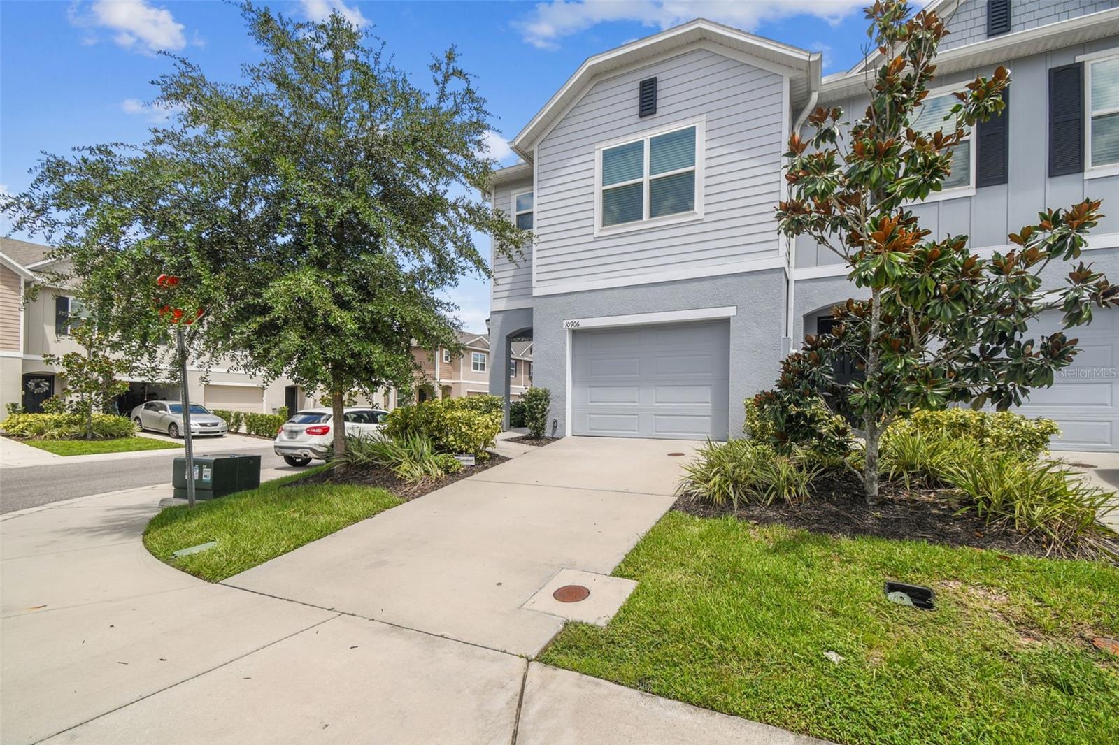 Stylish End-Unit Townhome – Built in 2021, No CDD & Low HOA! Welcome to 10906 Flying Squirrel Avenue, a beautifully designed 3-bedroom, 2.5-bathroom end-unit townhome offering 1,758 sq. ft. of modern living space in a prime Tampa location. Built in 2021, this home blends contemporary finishes with a smart, open layout perfect for both daily living and entertaining. The light-filled main level features a spacious great room that flows seamlessly into the dining area and gourmet kitchen. The kitchen boasts sleek dark cabinetry, granite countertops, stainless steel appliances, a large walk-in pantry, and a generous island with breakfast bar seating. Neutral tile flooring throughout the first floor keeps the space feeling fresh and easy to maintain. Upstairs, you’ll find a private owner’s suite with a walk-in closet and en-suite bath, plus two additional bedrooms and a full bathroom. A convenient laundry closet is also located on the second floor. As an end unit, you’ll enjoy extra natural light, added privacy, and a larger side yard. The community offers a low-maintenance lifestyle with NO CDD fees and a remarkably low HOA of just $160/month. Ideally situated with quick access to I-75, I-4, and the Selmon Expressway, you’re minutes from top-rated restaurants, shopping, and everyday conveniences. Downtown Tampa, Ybor City, and Brandon are all just a short drive away. Don’t miss the opportunity to own this nearly new, move-in ready home in a highly desirable location!