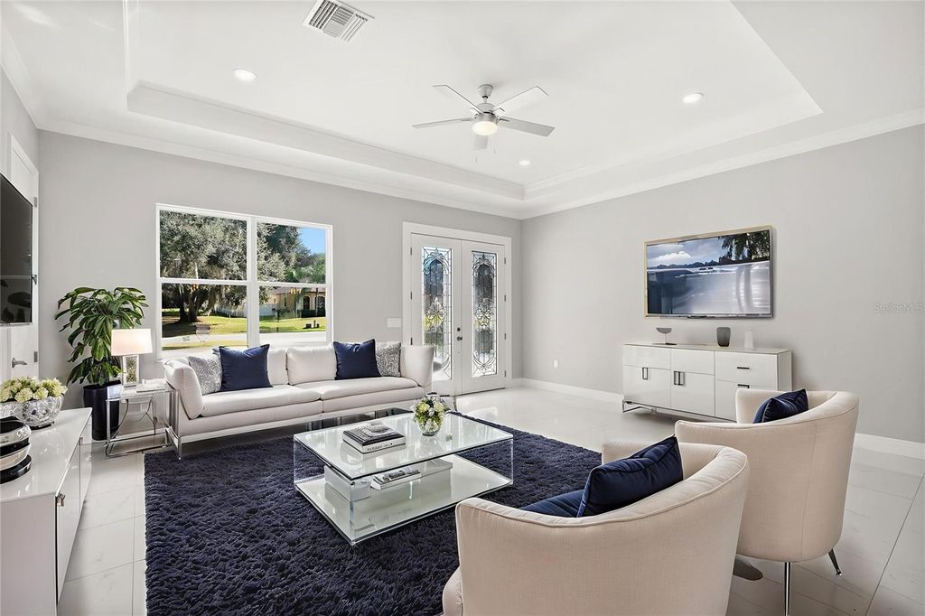 Photo of 319 Water Shore Drive, Leesburg, FL 34748 (MLS # O6364130)