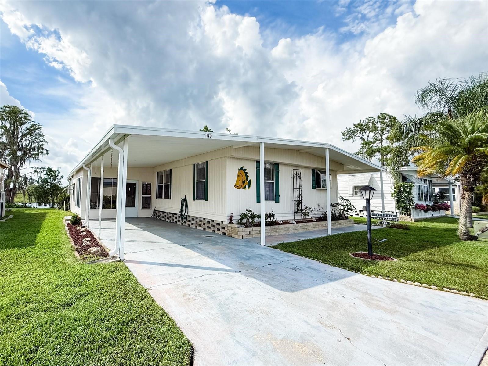 Don’t miss this rare opportunity to own a 3 bedroom 2 bath home sitting on a canal on Clermont chain of Lakes! Emerald Lakes co-op is a 55+ active adult community with so much to offer including heated pool, clubhouse with endless activities and low monthly dues of $305, which include Cable, Internet, Water, trash & grounds maintenance. NO LOT RENT here because you are a shareholder. Electrical panel was just replaced (July 2025) This home just received a new roof (April 2025) and Dock was rebuilt plus new flooring in bedroom 2 of the home which will save you thousands. Just bring your boat or jet ski and get ready to enjoy the lakefront lifestyle of fishing from your backyard dock, cruising on any of the 11 lakes to salt shack, tiki bar, or Clermont Beach on Lake Minneola, The Cove bar on Lake Minnehaha or all the way to Lake Louisa State Park, which consists of 4,372 acre Florida State Park south of Clermont. Lake Louisa is the largest of the lakes in this chain and the least developed with maximum depth of 16 feet but the entire chain consists of approximately 10,000 acres of fishable Waters and hosts bass fishing tournaments, boat parades & live concerts.. Emerald Lakes has its own private boat ramp to launch your boat or jet skis, but there are also several public boat ramps on the Clermont chain. You can own a piece of paradise for under $300K. EZ to show so schedule your appointment today & expect to be impressed.