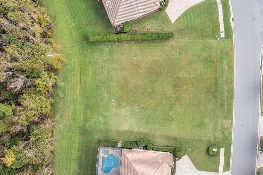 Build the home of your dreams in one of Central Florida's finest communities, Lake Forest, master-planned with winding, landscaped streets, a 55-acre lake and a vast nature preserve. Residents enjoy the 10,000-square-foot clubhouse where community events are curated for all ages throughout the year, such as the Dive-in Movie, Turkey Trot and more. The clubhouse features a fitness center, locker rooms and a Jr. Olympic swimming pool. Tennis courts, pickleball, beach volleyball and basketball are just steps away, as is the kiddie pool. Lake Forest is home to multimillion-dollar residences and enjoys a 24-hour manned entry gate with shopping and dining just moments away. This ready-to-build lot is ideally situated on the most desirable south bend of Broadoak Loop and fronts the nature preserve. Spanning over 4/10ths of an acre, this lot will accommodate a substantial residence. Bring your own builder and start planning your dream home today.